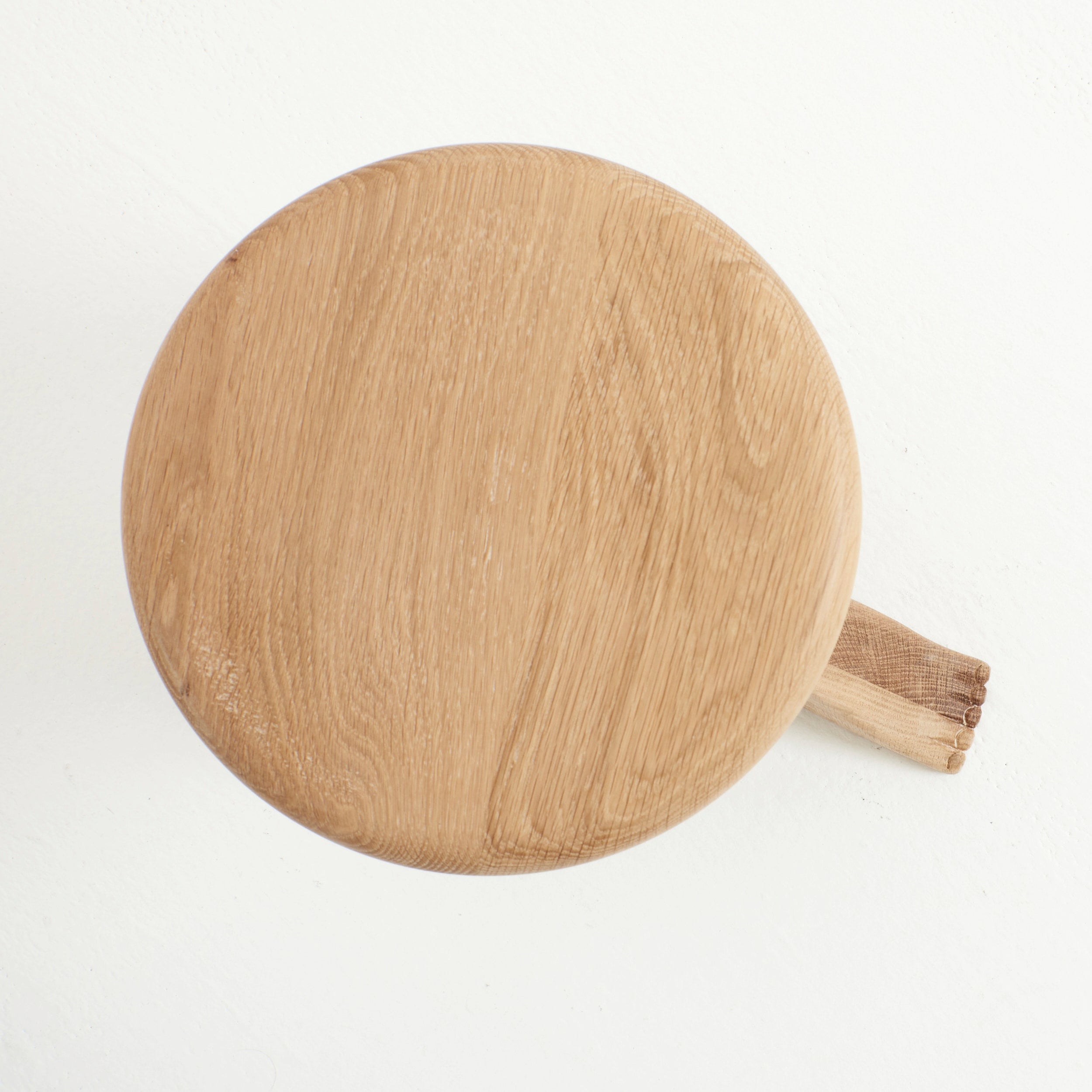 Foot Stool in Oak — top view of round oak seat