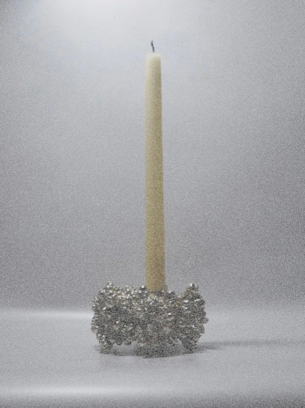 Chrome Candle Holder — side view of metallic surface with candle