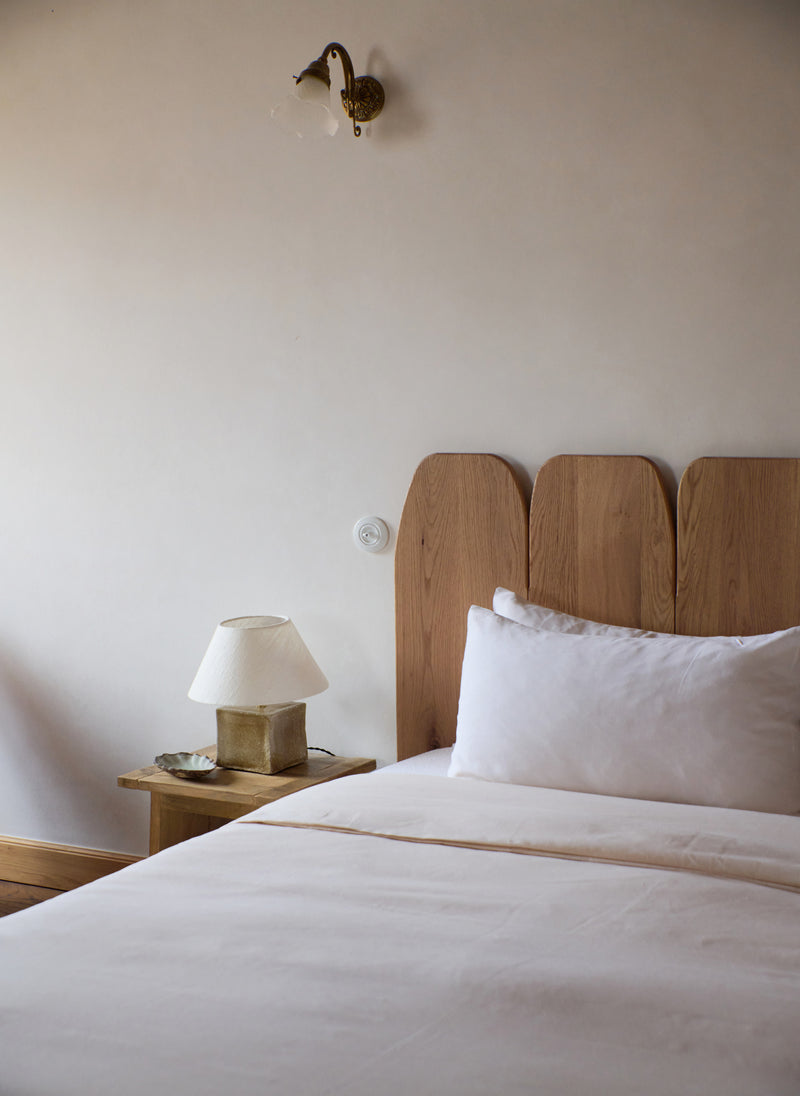 Arouca Table Light Brown Sugar — bedside view in modern bedroom setting