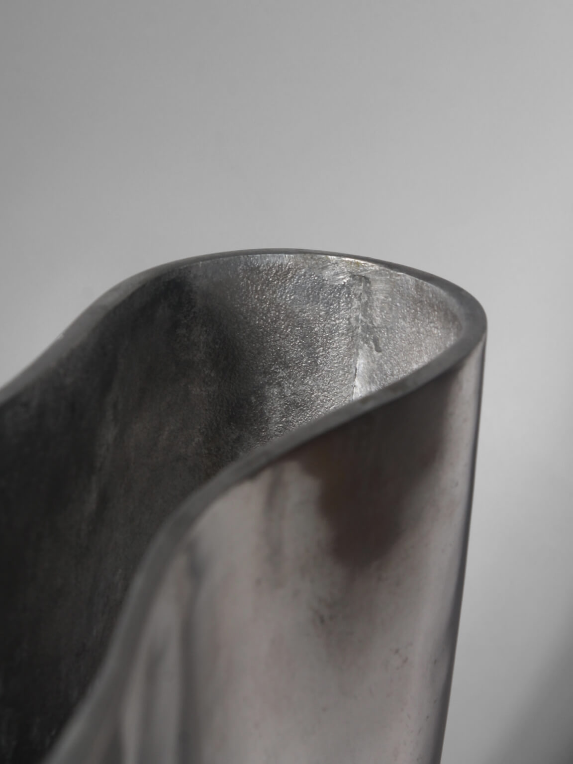 Polished Aluminum "Anatomi" Large Vase by Anna Efverlund — lifestyle setting