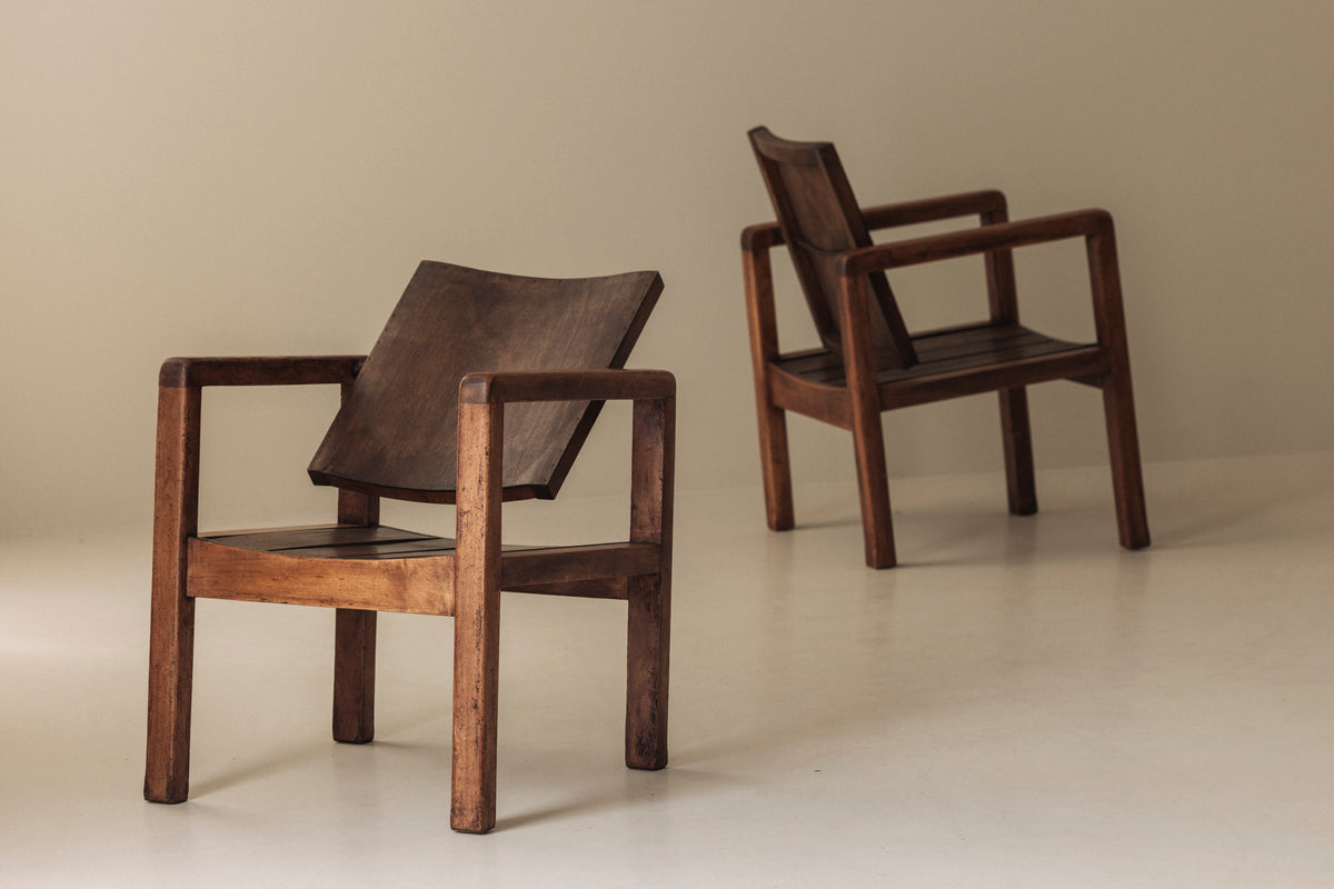 Pair of French Modernist Mahogany Armchairs, 1950s — side angle