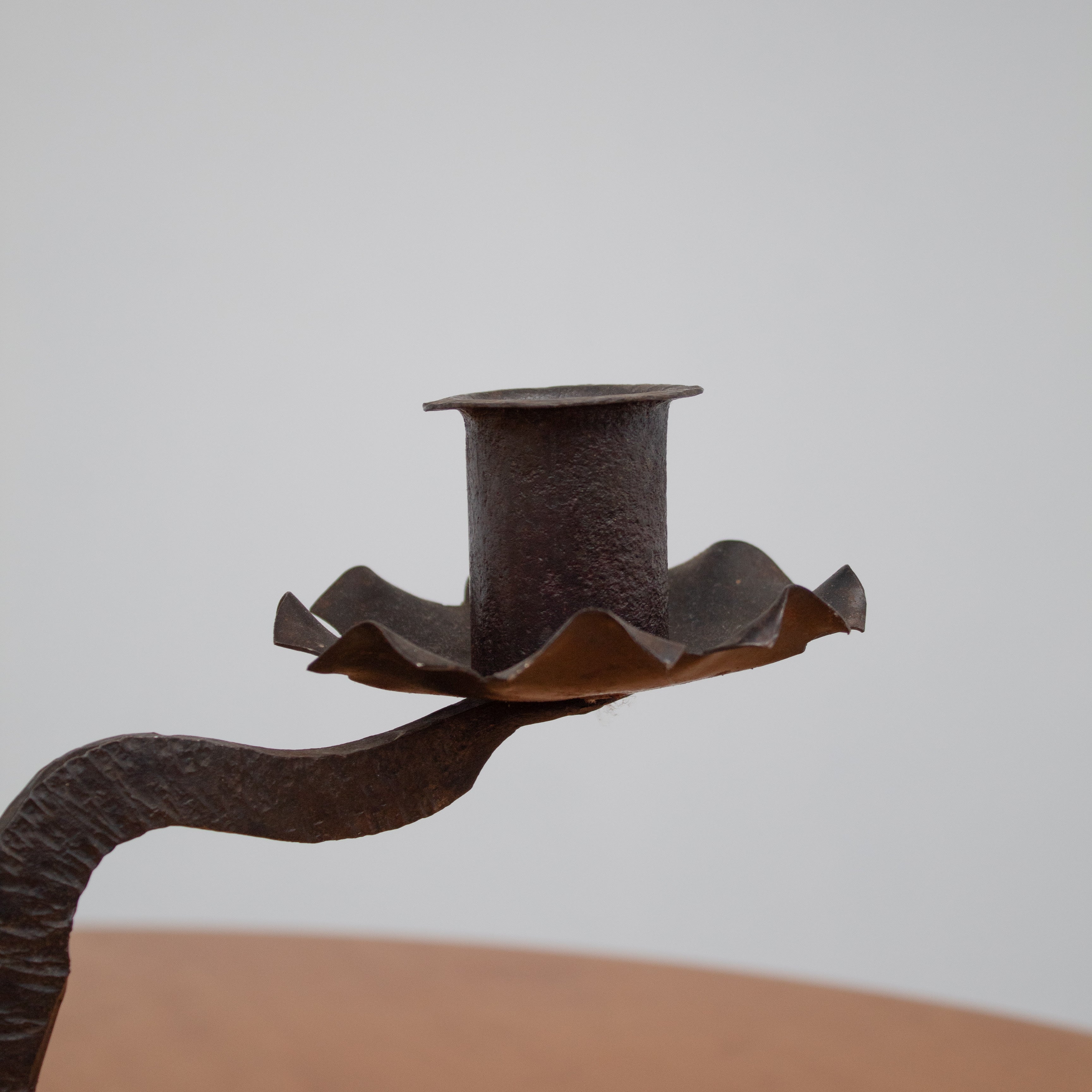 Vintage Candle Holders in Metal - Pair Collection — close-up of dark metal holder on wooden table