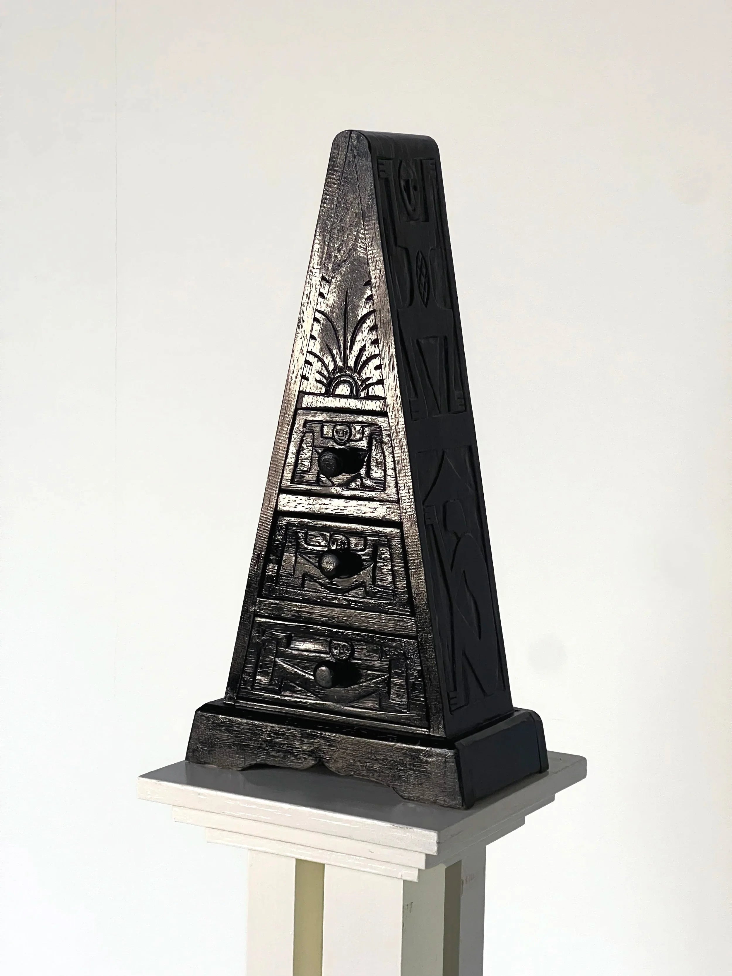 Triangle Small Chest of Carved Drawers — close-up of black carved wood detail