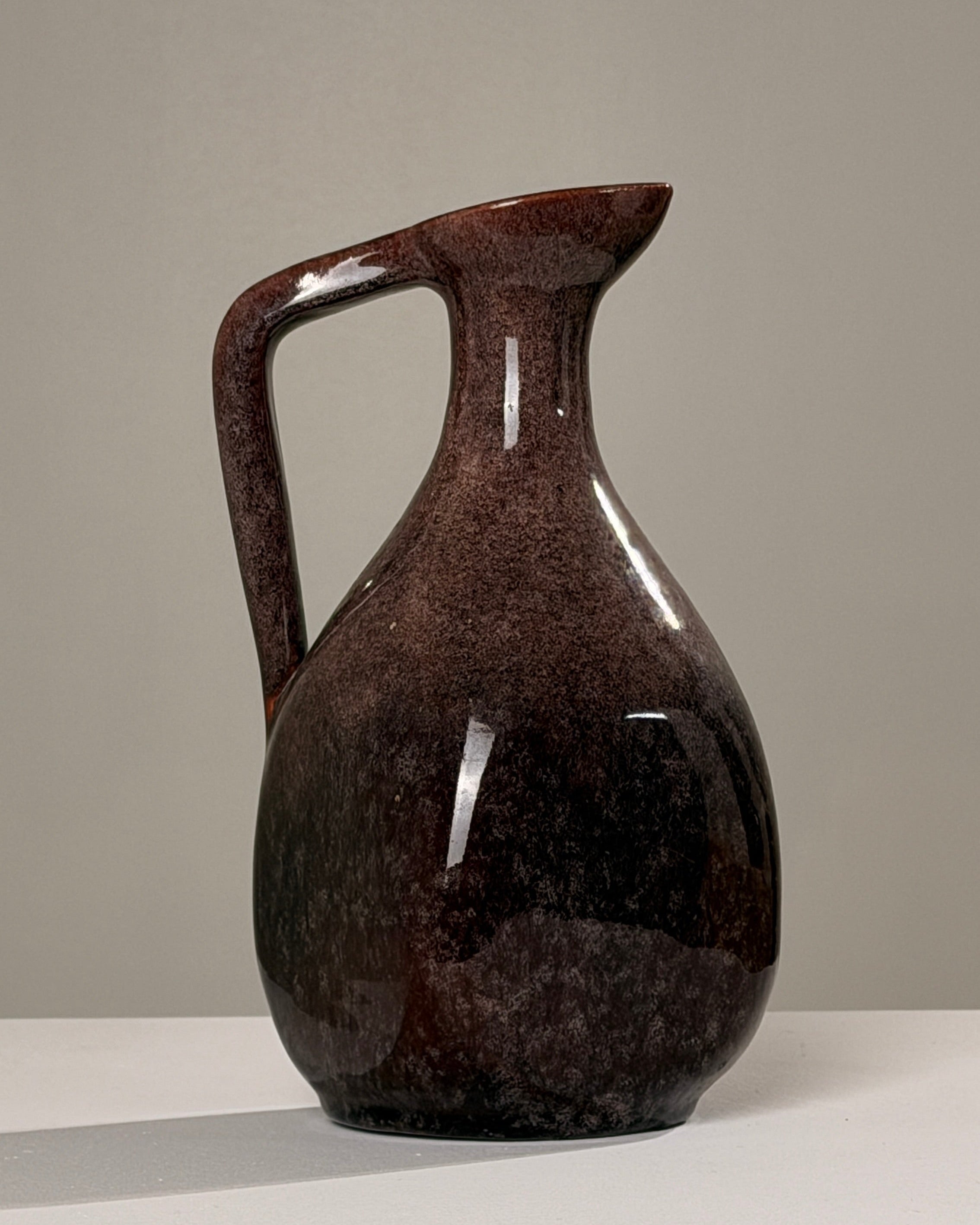 Ceramic pitcher by Accolay potters | The Oblist — dark brown glaze, vintage artisan