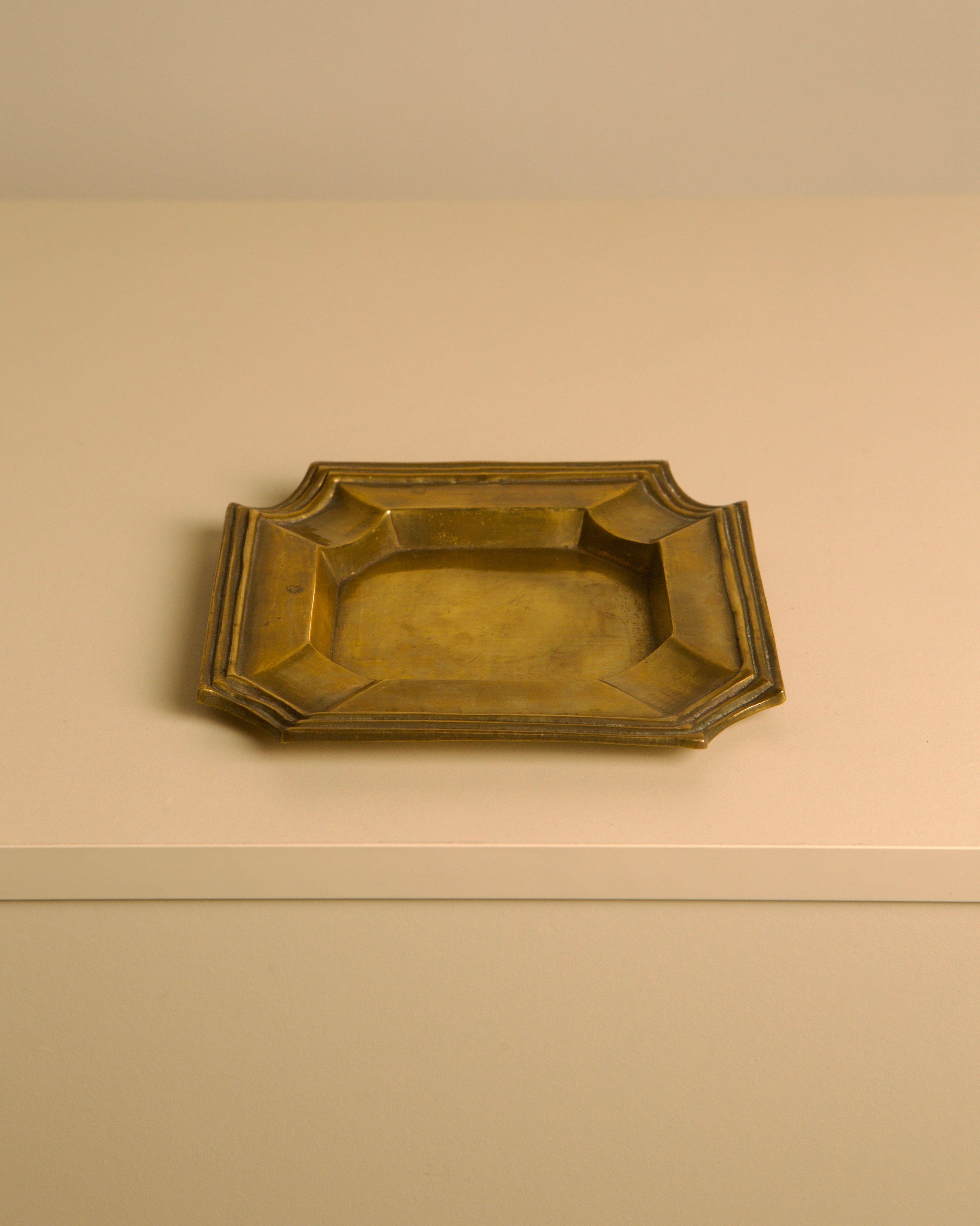 Italian "Octagonal" Brass Trinket Tray, 1960s — close-up of brass surface on neutral background