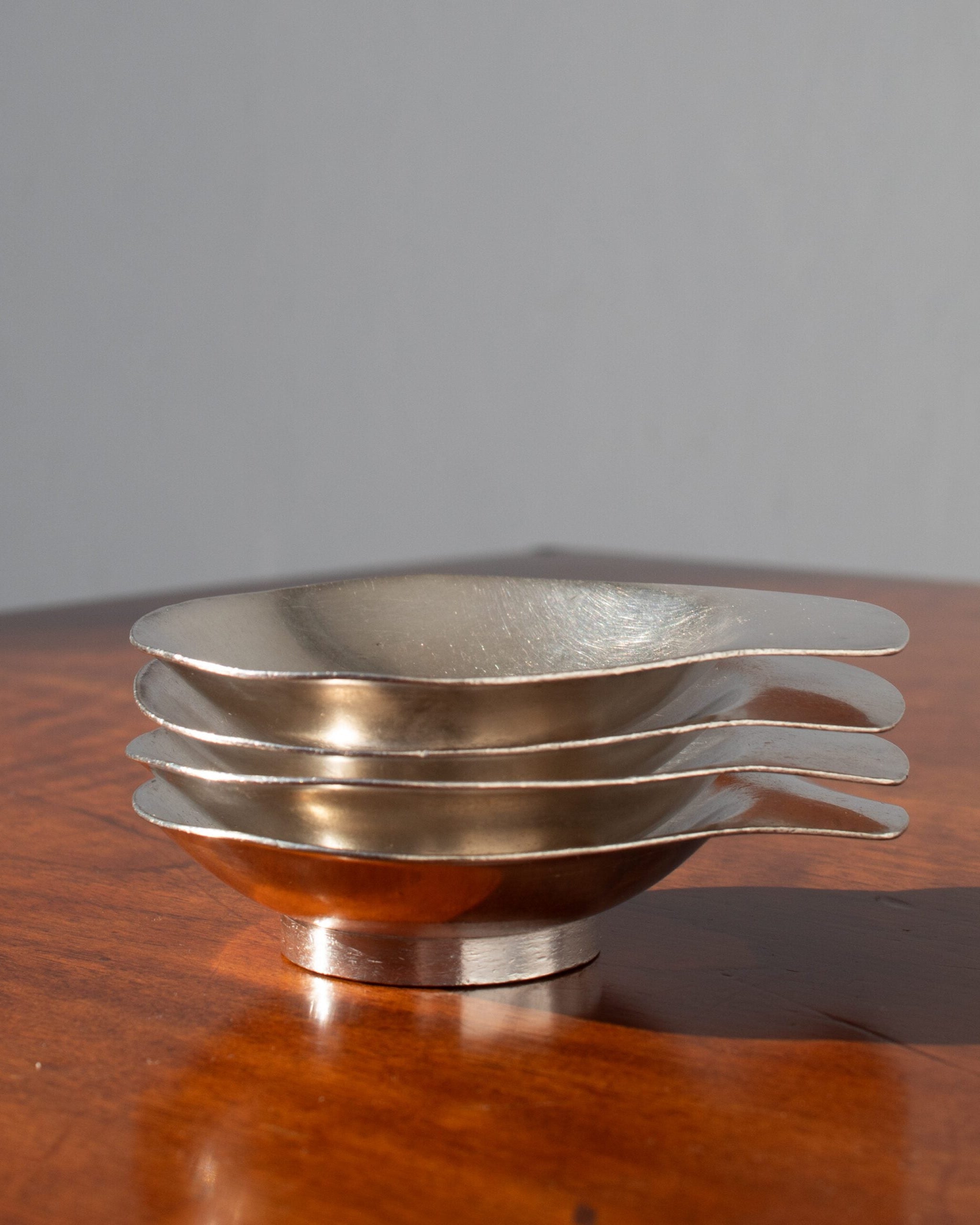 Arthur Krupp Dessert Plates in Metal by Malata Antwerp | The Oblist — brushed metal finish, modern design
