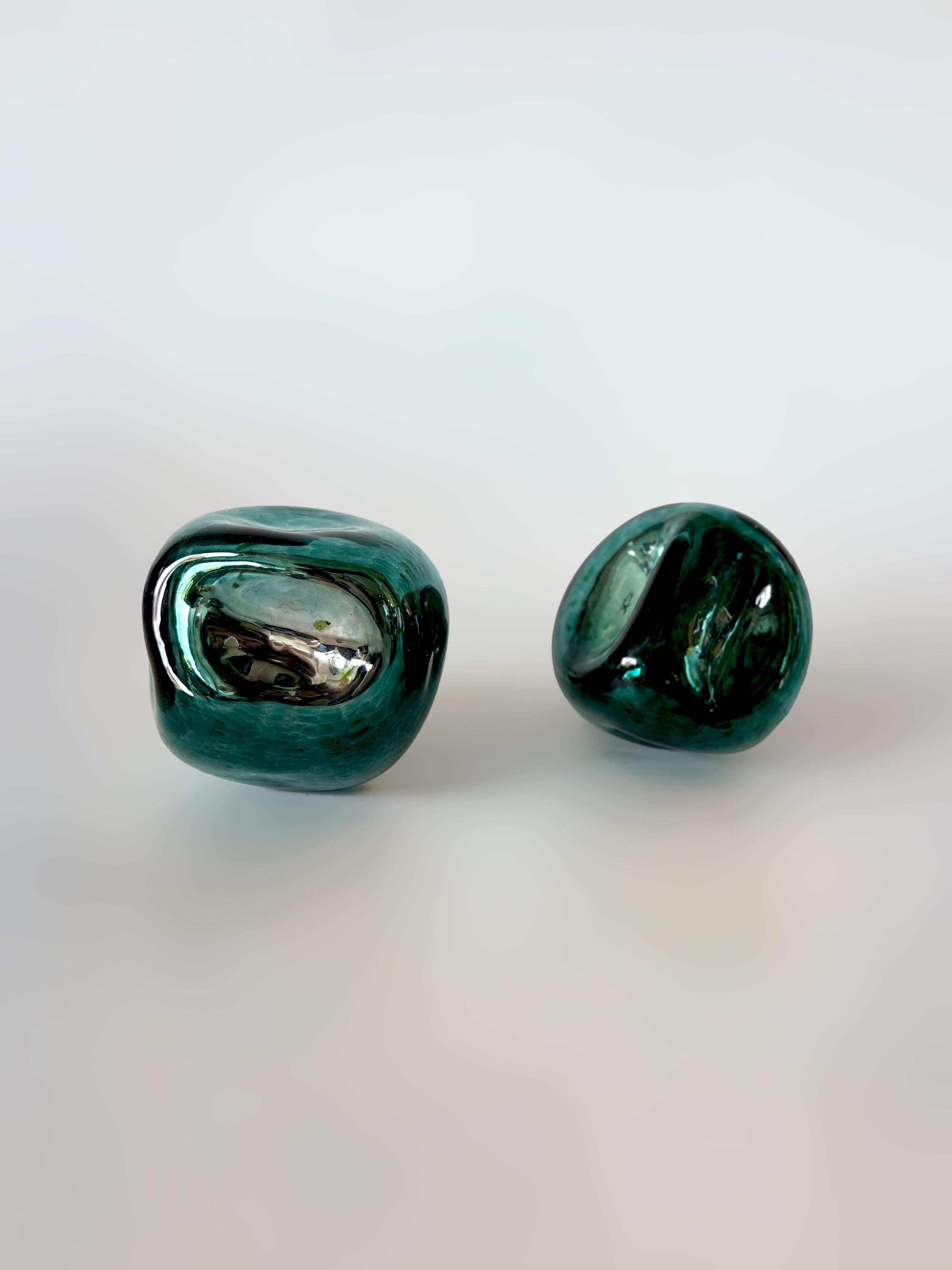 Knob Collection Sculptures in Glass — two green glass sculptures on white background