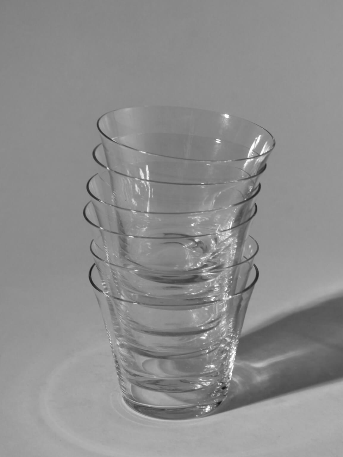 Albert Gustav Bunge Coffee Cups Set — stacked transparent glass cups on gray background
