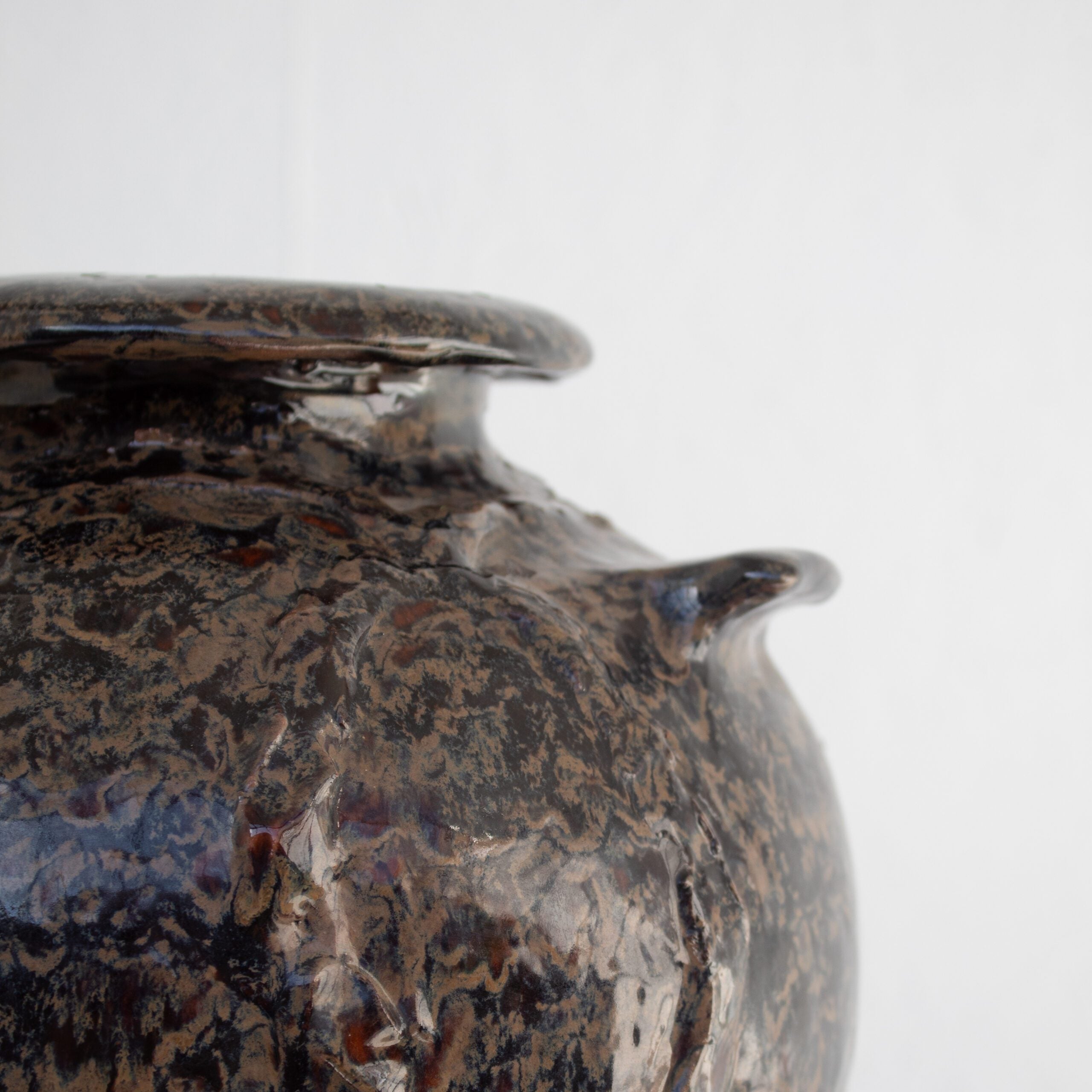 Ceramic Flower Pot / Vase — close-up of dark ceramic surface