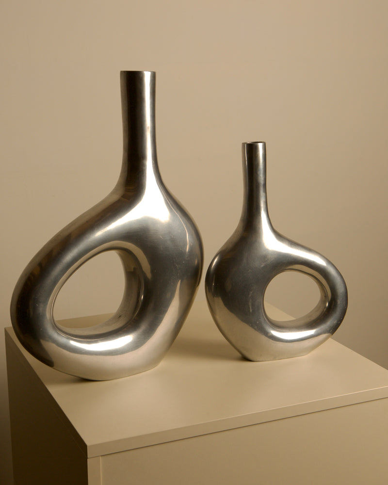 Pair of Italian cast aluminum vases from the 1980s by Treaptyque | The Oblist — polished silver finish