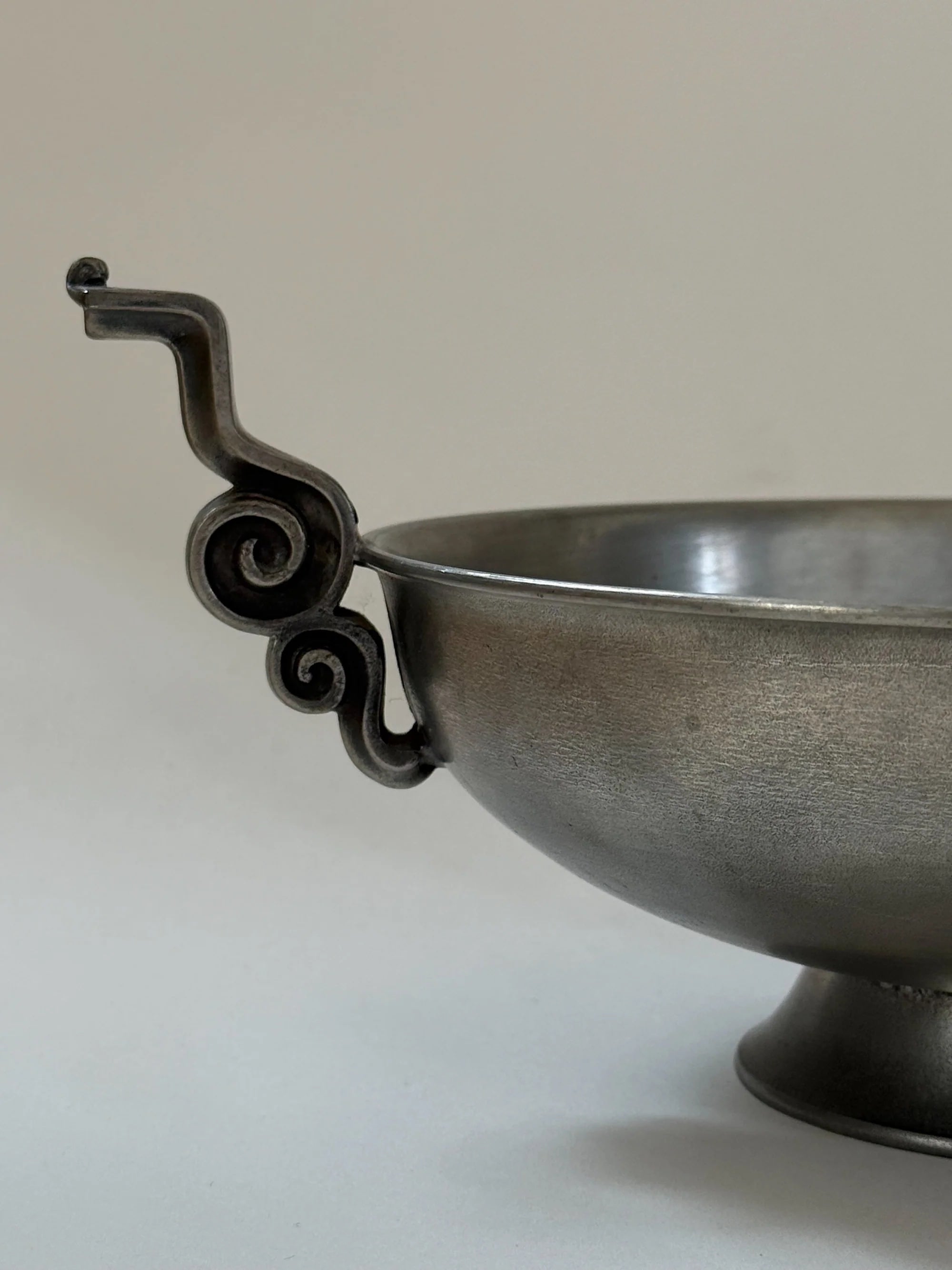 Pewter Bowl with Scroll Handles Edvin Ollers, 1952 — angled view highlighting scroll handle detail