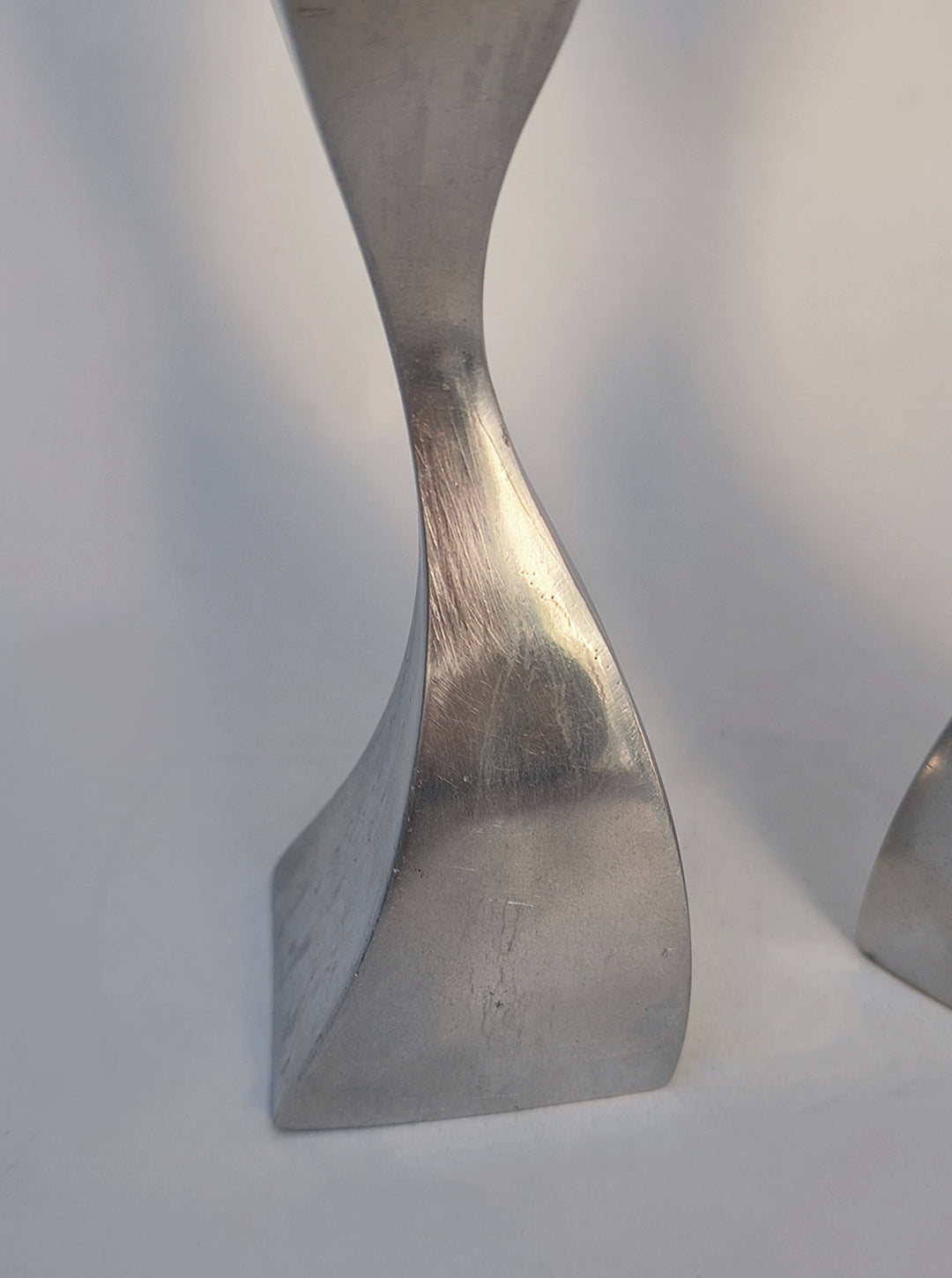 Twisted Candle Holders — side angle showing brushed metal finish
