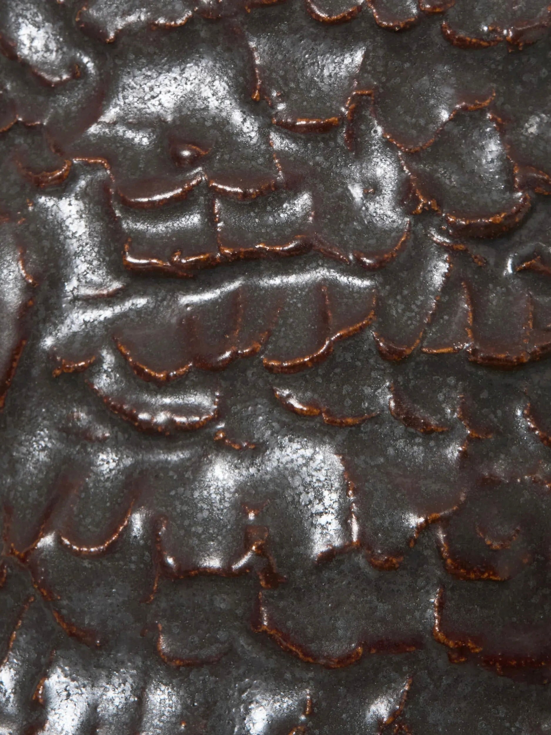 Casa Wall Light No3 — close-up of textured dark ceramic surface