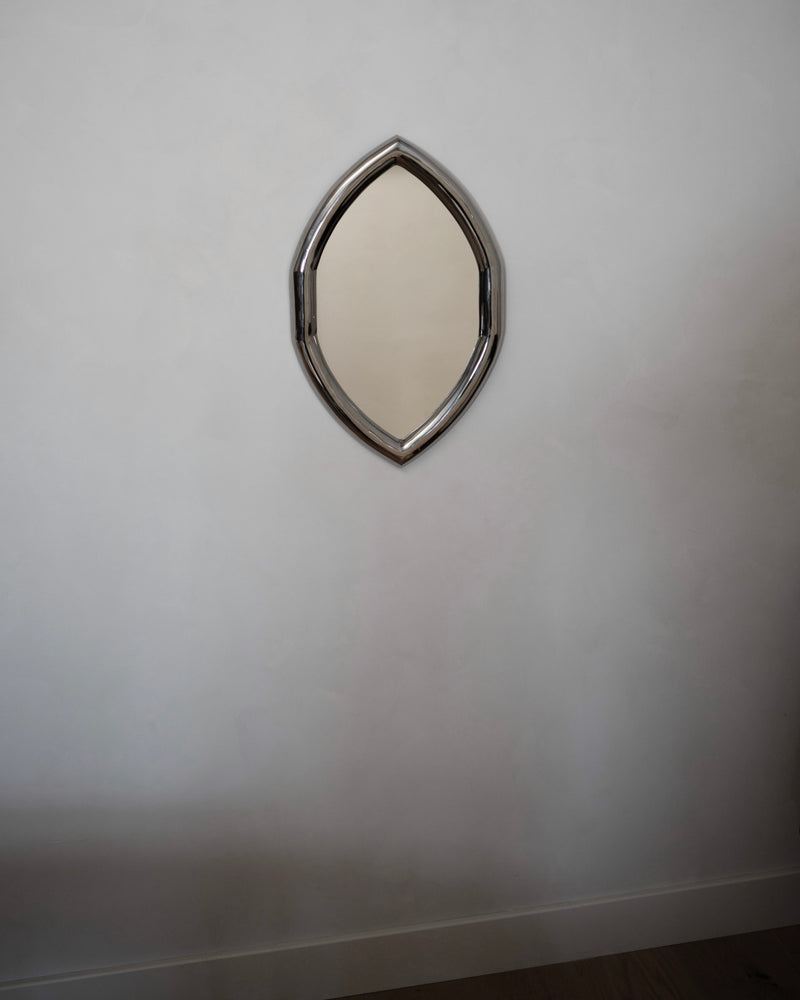 Iris Mirror - Titanium — front view on light wall