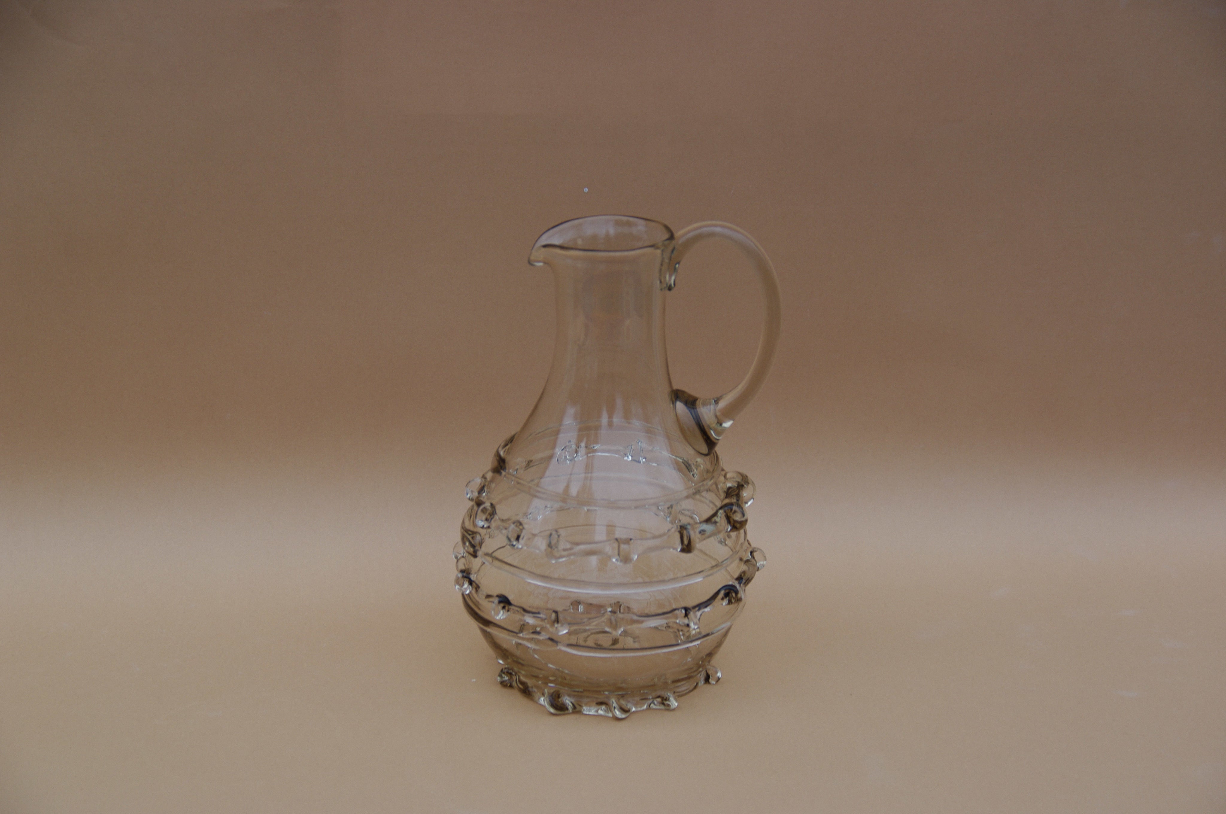 Contemporary Carafes in Glass with ornaments - Mouthblown Collection — side view highlighting glass texture and decorative el