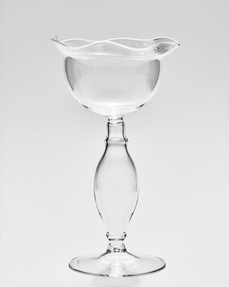Clear glass wine goblet with ruffled rim and elegant stem design