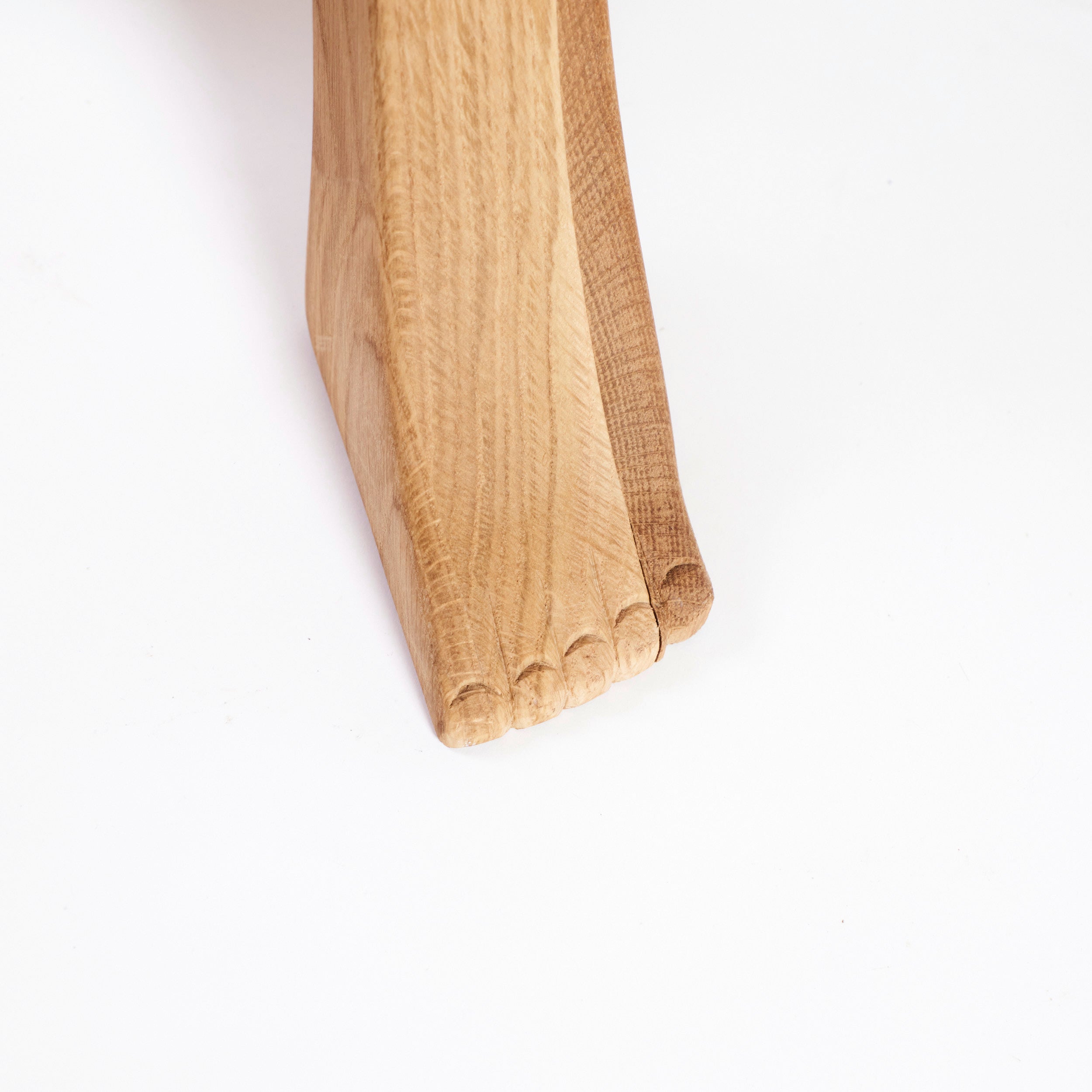 Foot Stool in Black Chestnut — close-up of wooden leg detail