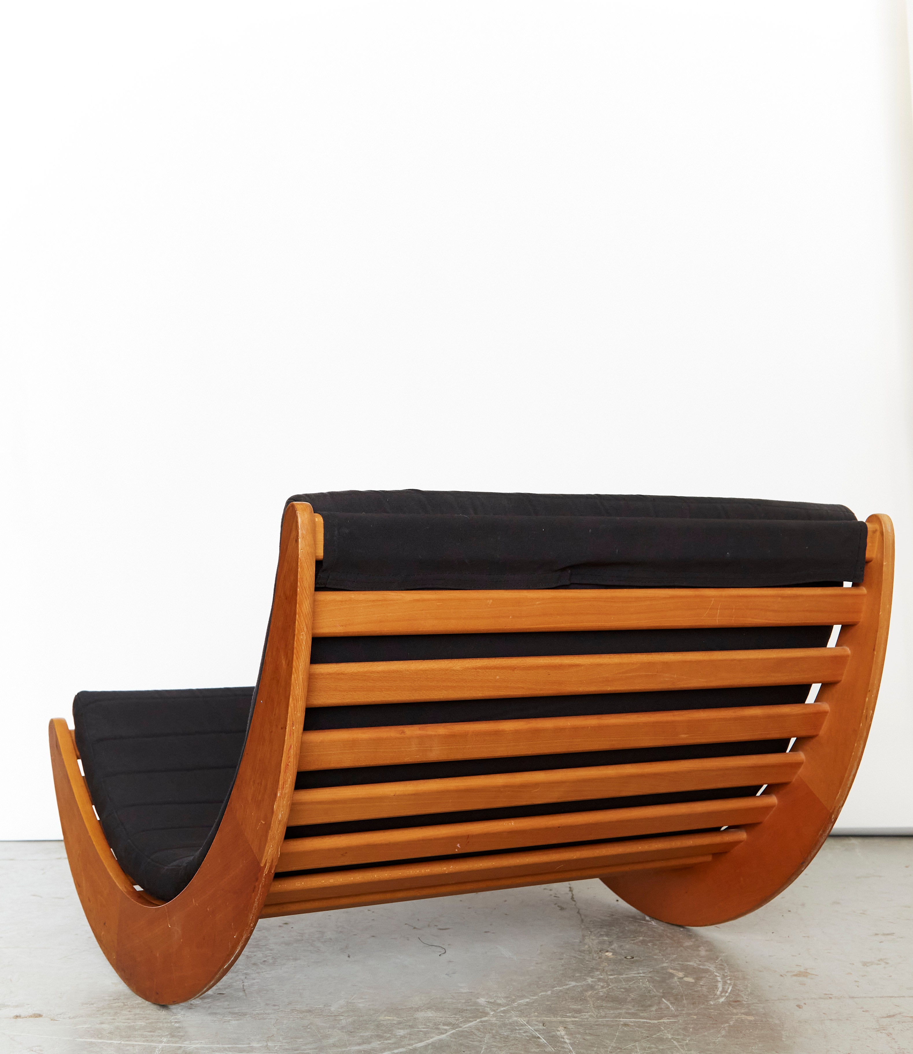 Tandem Relaxer 2for2 Rocking Chair by Verner Panton for Rosenthal — angled view showing wooden frame and black cushion