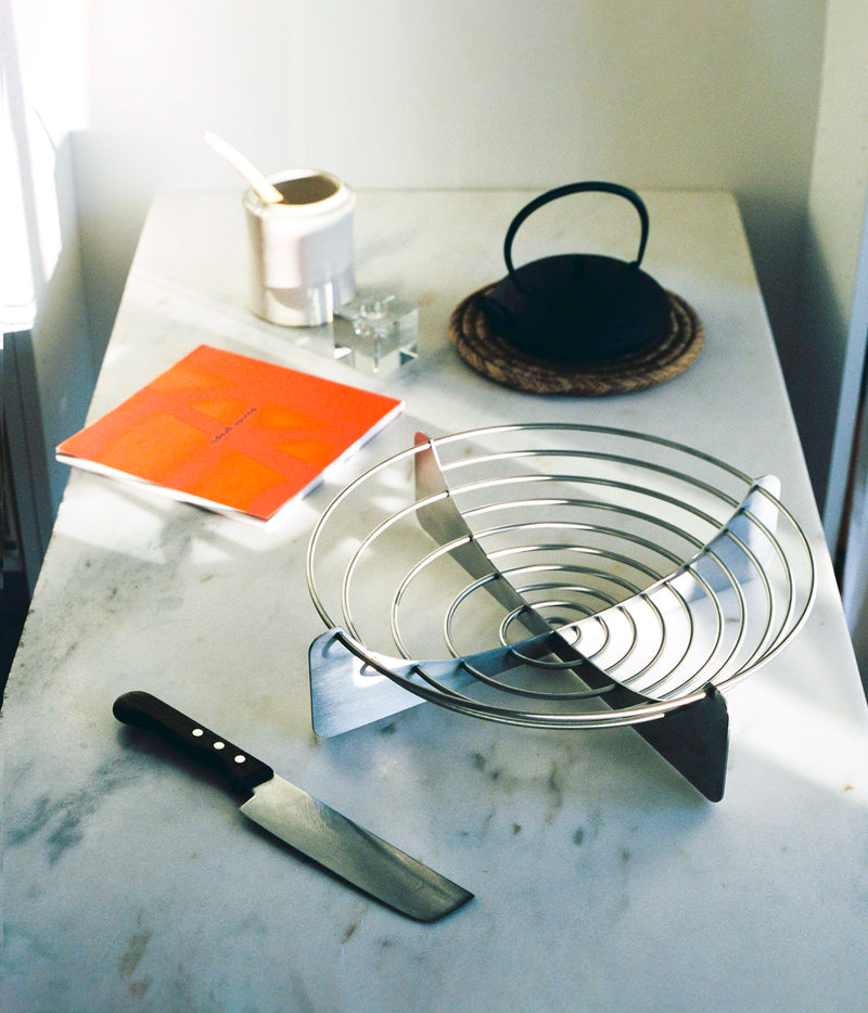Draft Bowl Large — close-up of stainless steel design on marble surface
