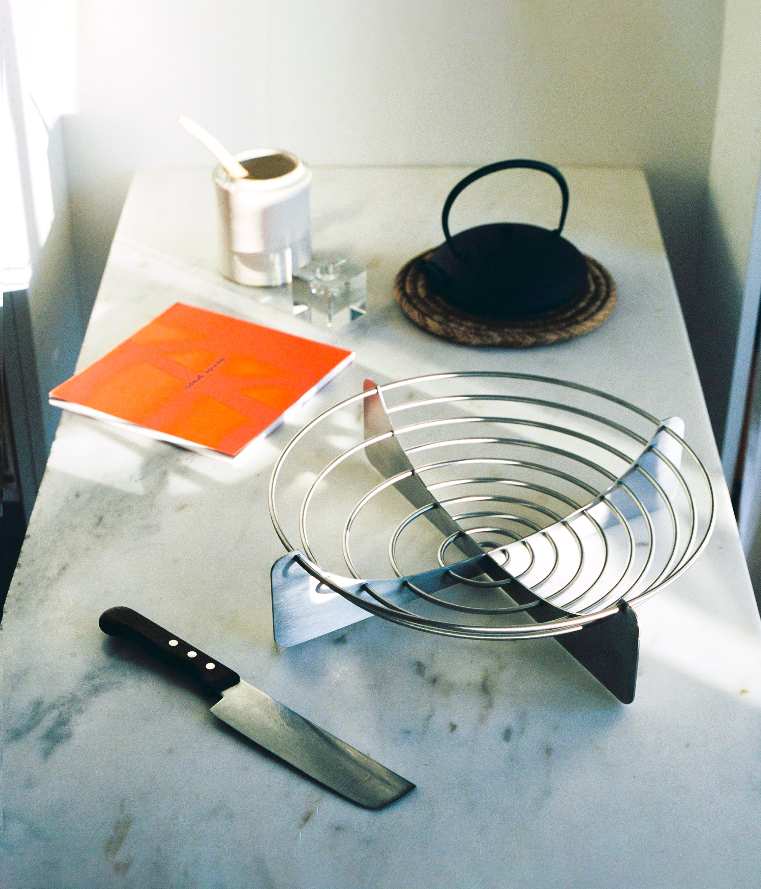 Draft Bowl Large — close-up of stainless steel design on marble surface