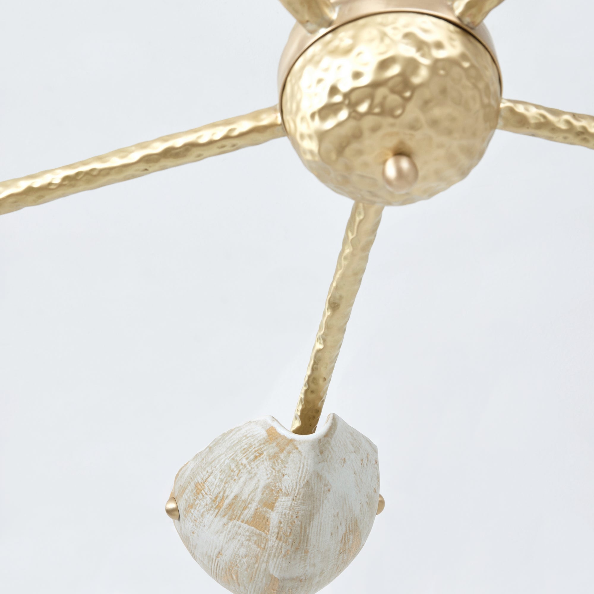 Serrallés Chandelier — back view highlighting hammered brass and white detail