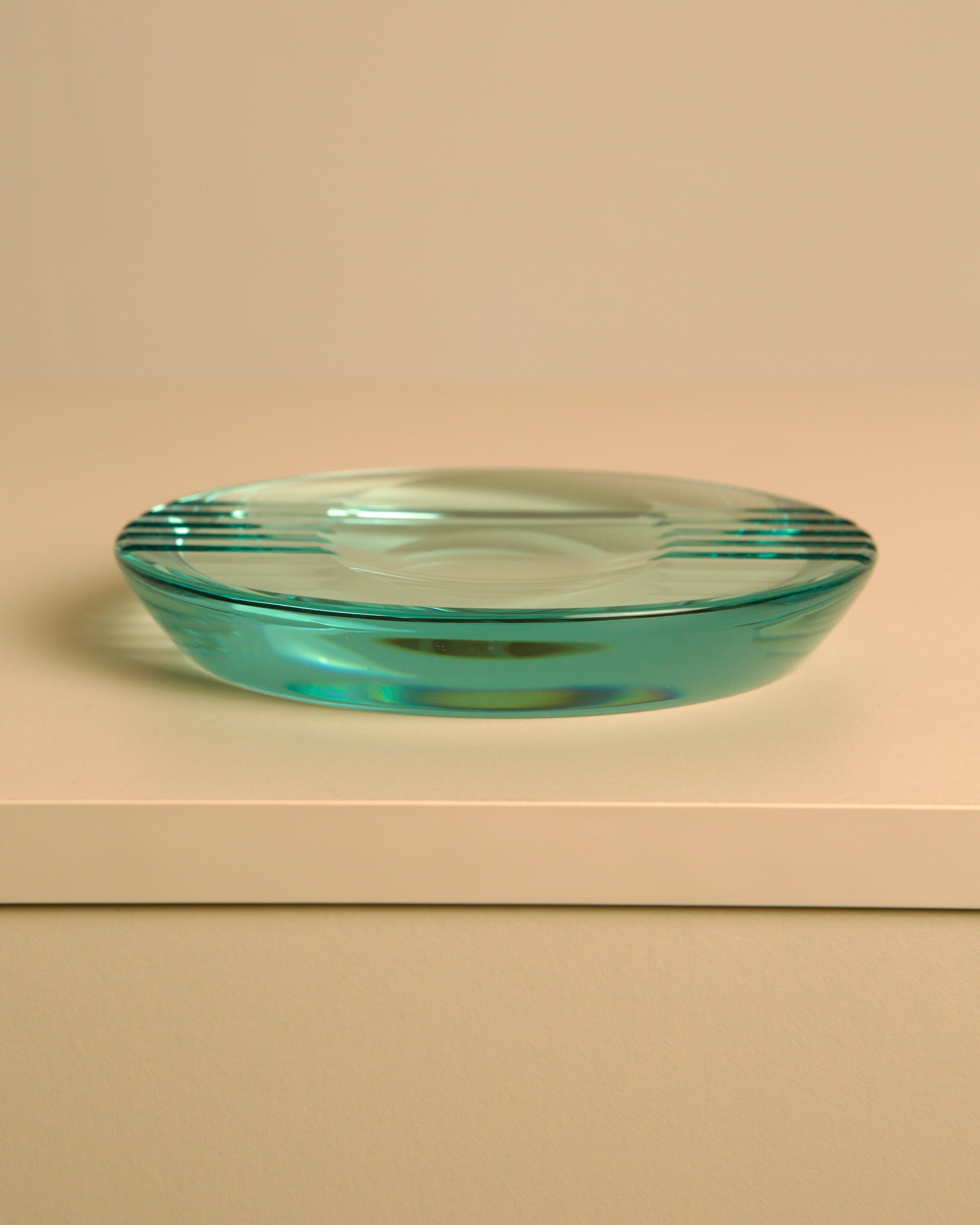 Round Italian Glass Ashtray by Fontana Arte, 1970s — close-up view of turquoise glass surface