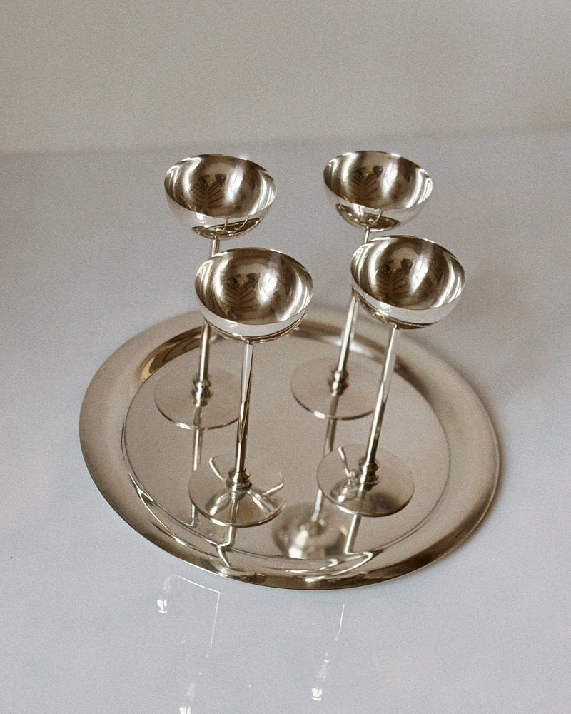Silver plated server set with four stemmed bowls on round tray