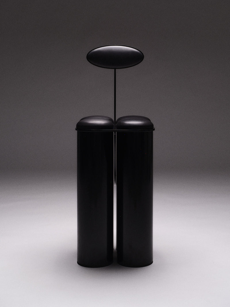 Giulio Stool — front view of black cylindrical design
