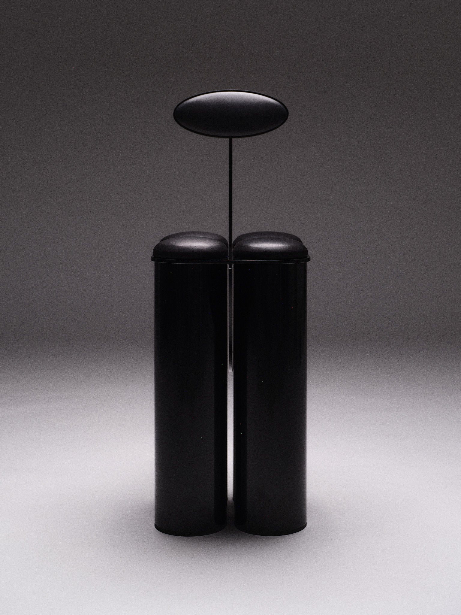 Giulio Stool — front view of black cylindrical design