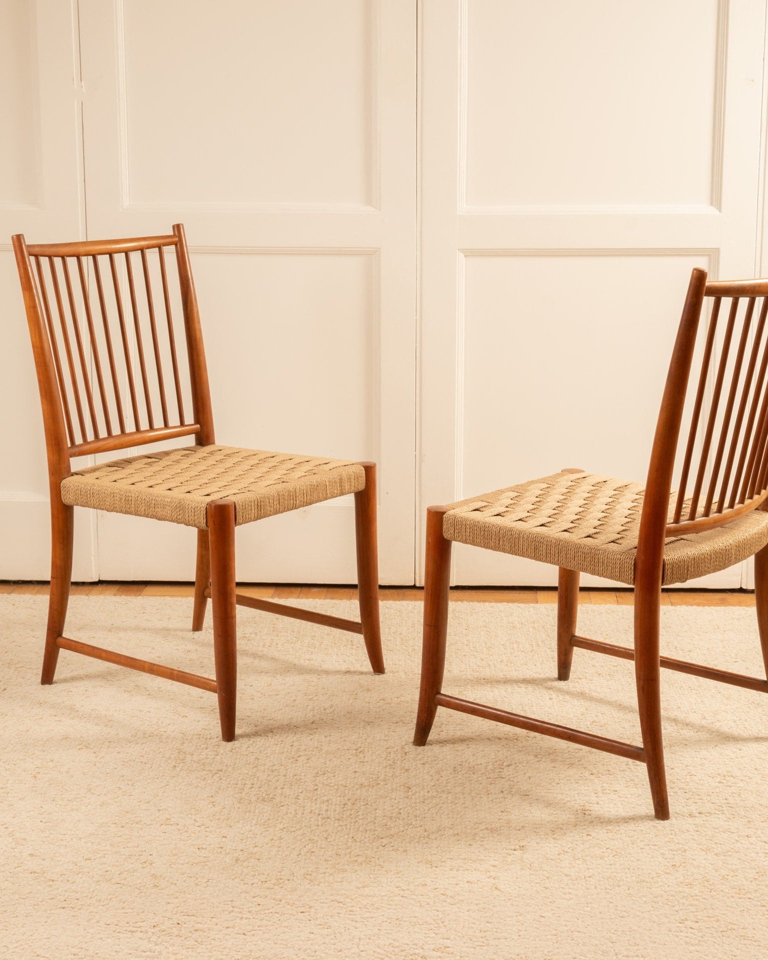 Mid-century teak dining chairs with woven cord seats by Paolo Buffa