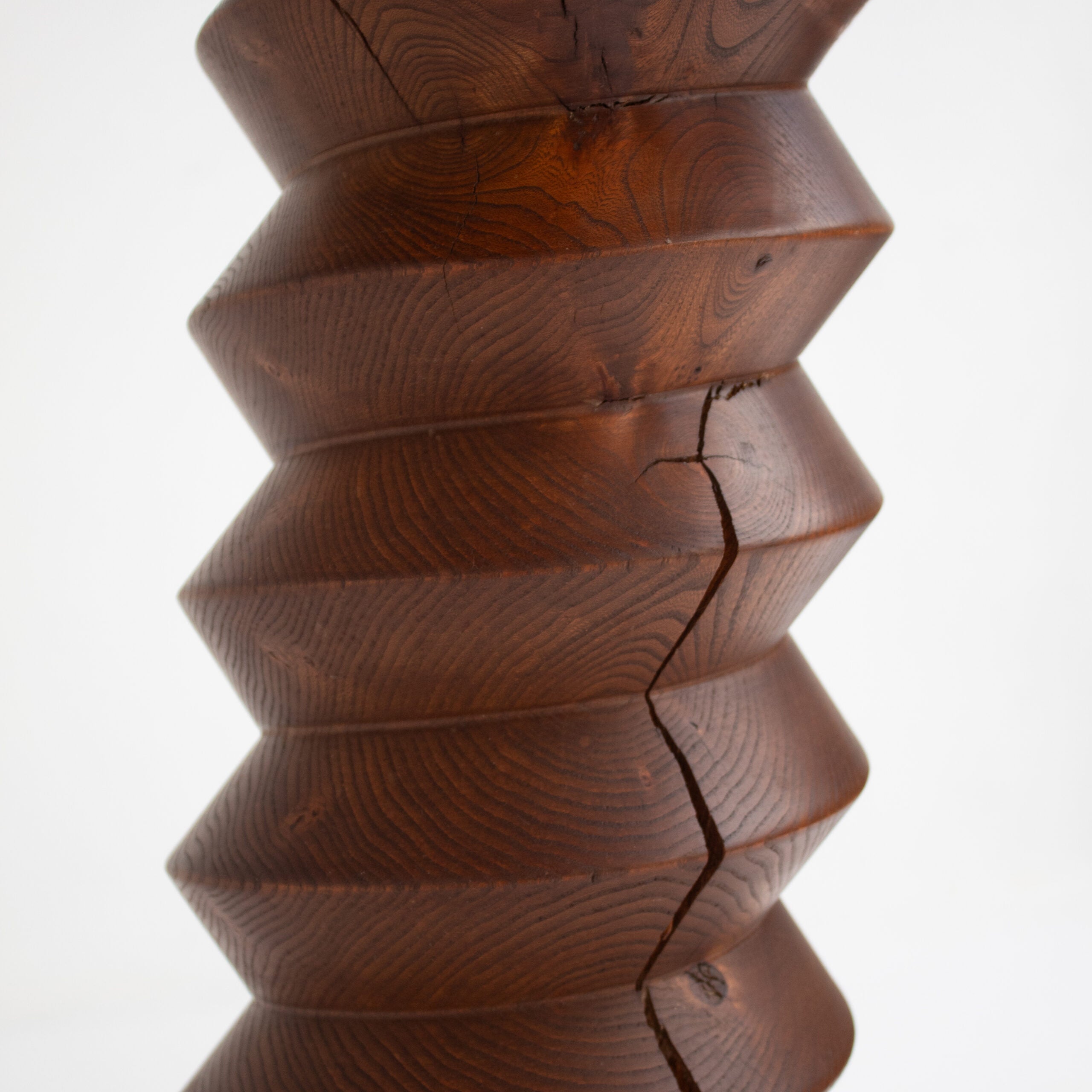 Sculptural Wooden Pillar in Solid Elm with Twisted Geometric Carving — in context