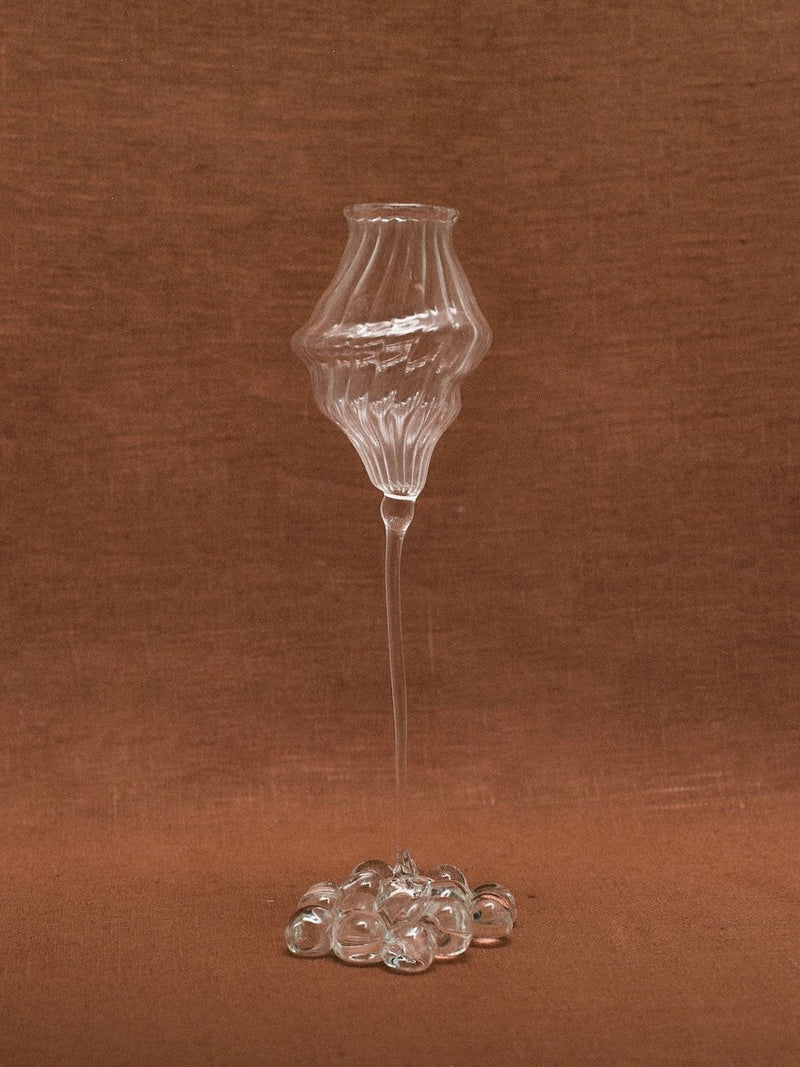 Orphée Liqueur Glasses – Mouth-Blown Set of 2 — close-up of glass texture on brown backdrop