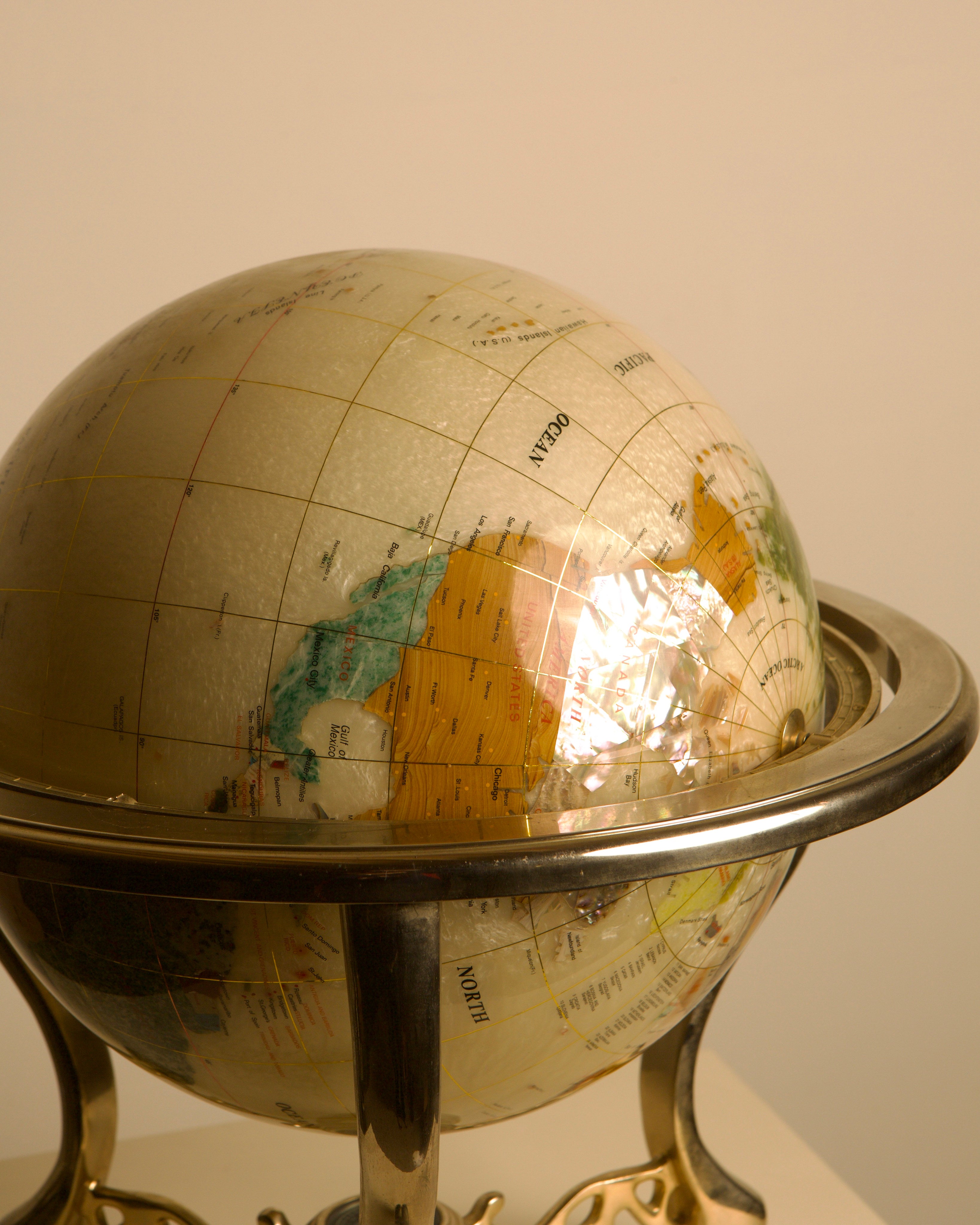 Large Globe Made of Hardstone and Mother-of-pearl, 1970s — close-up of globe's textured surface and map details