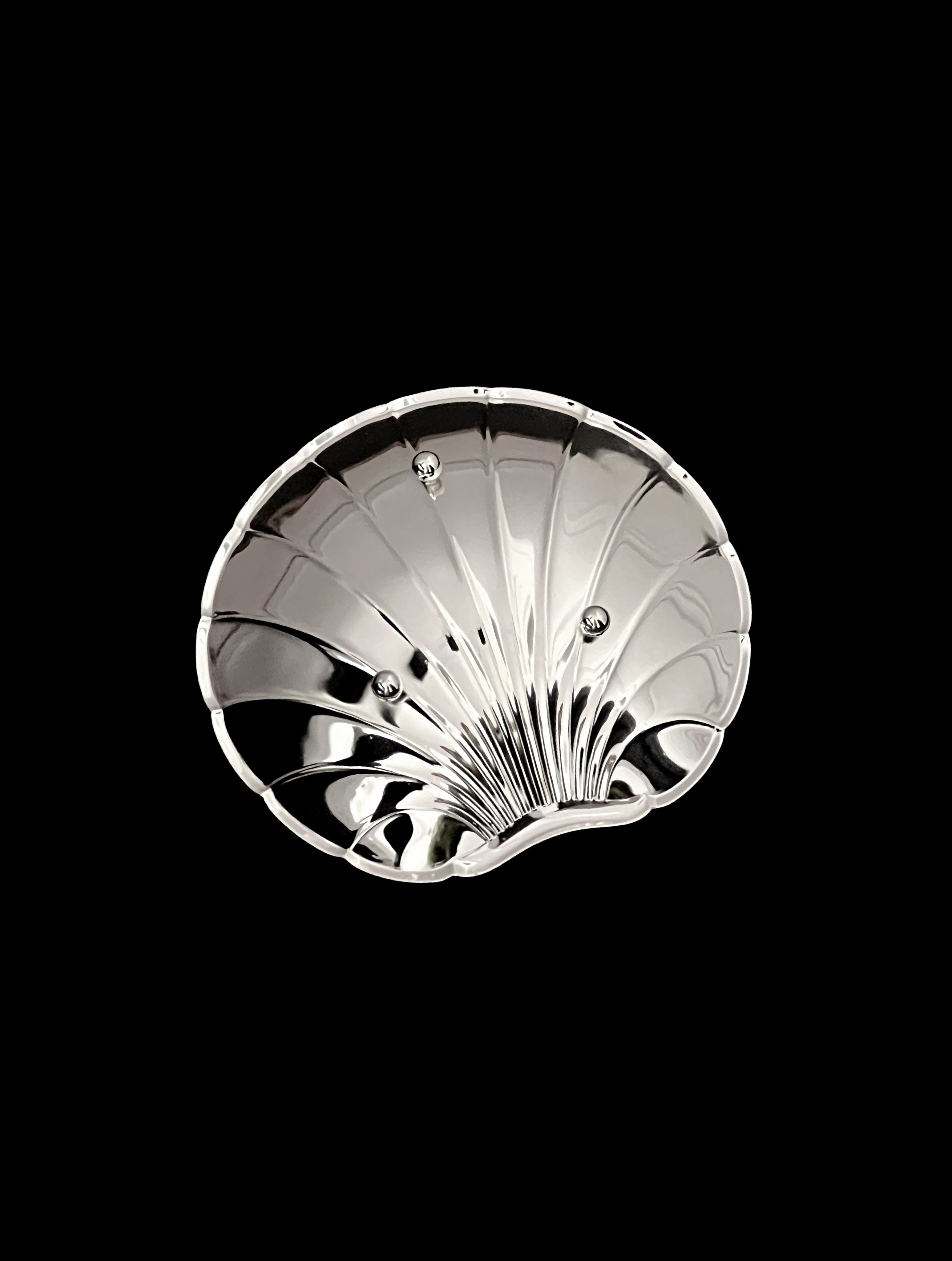 Vintage silver-plated shell dish detail view showing decorative ridged pattern