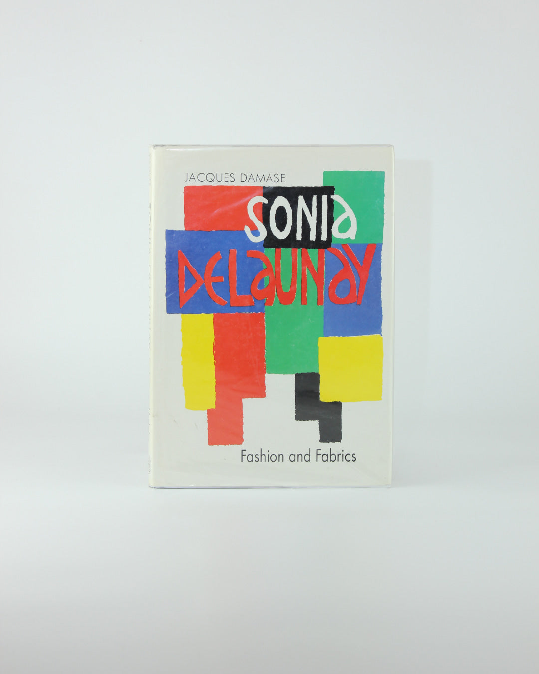 Sonia Delaunay: Fashion and Fabrics — front cover with colorful geometric design