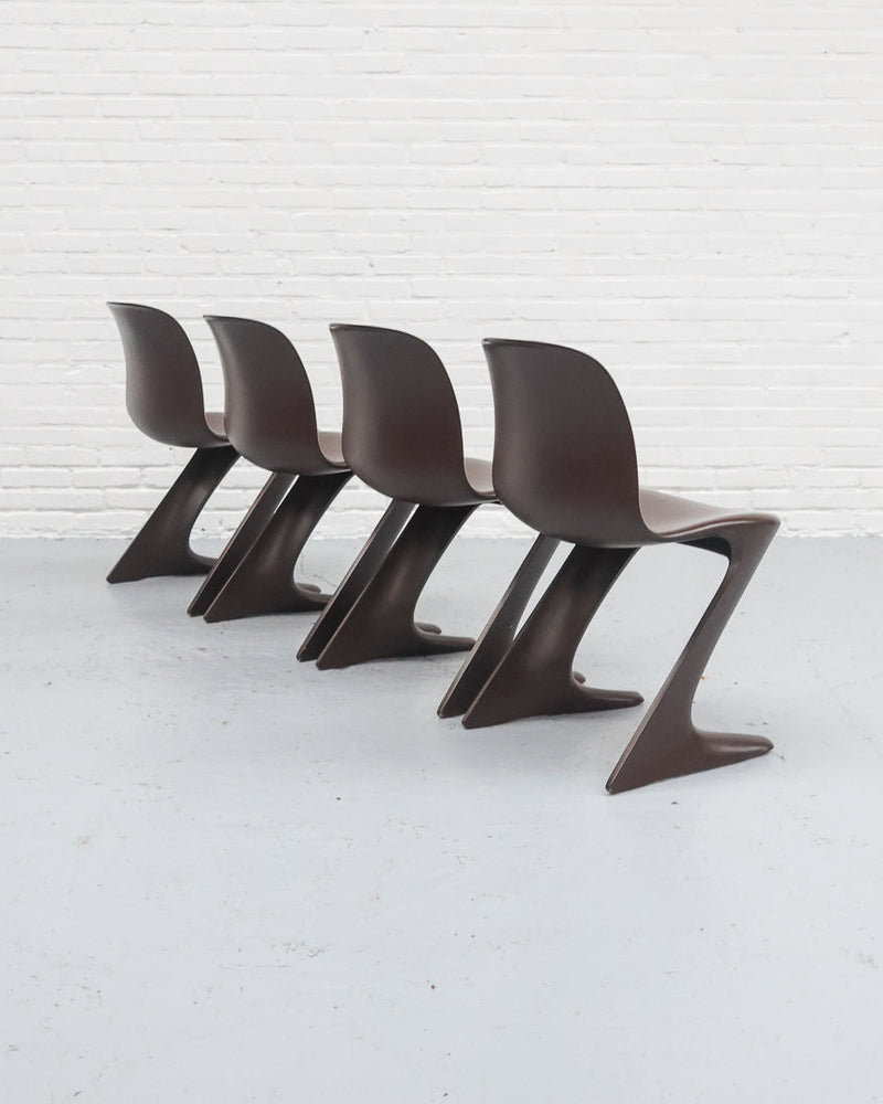 Four brown Ernst Moeckl Z chairs arranged in row, cantilever design