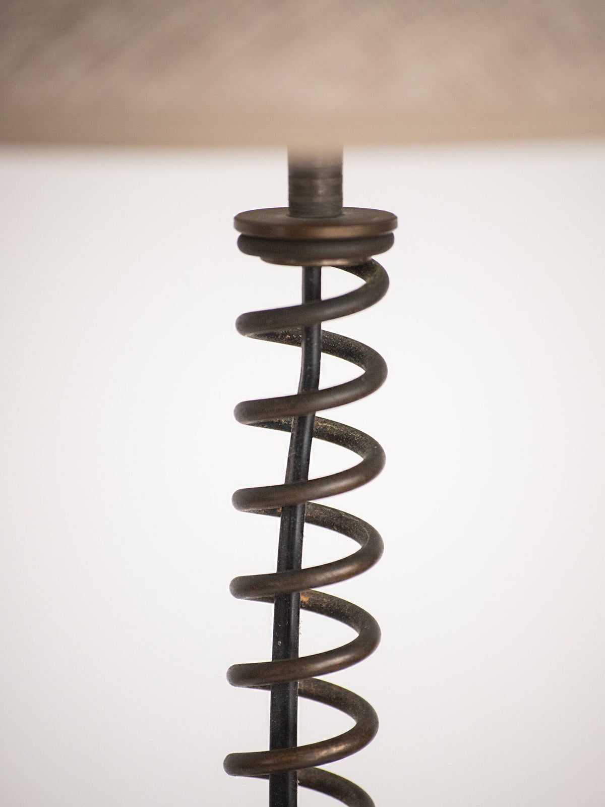 Coil Spring Table Lamp in Patinated Iron with Linen Shade, European, Second Half of the 20th Century — close-up