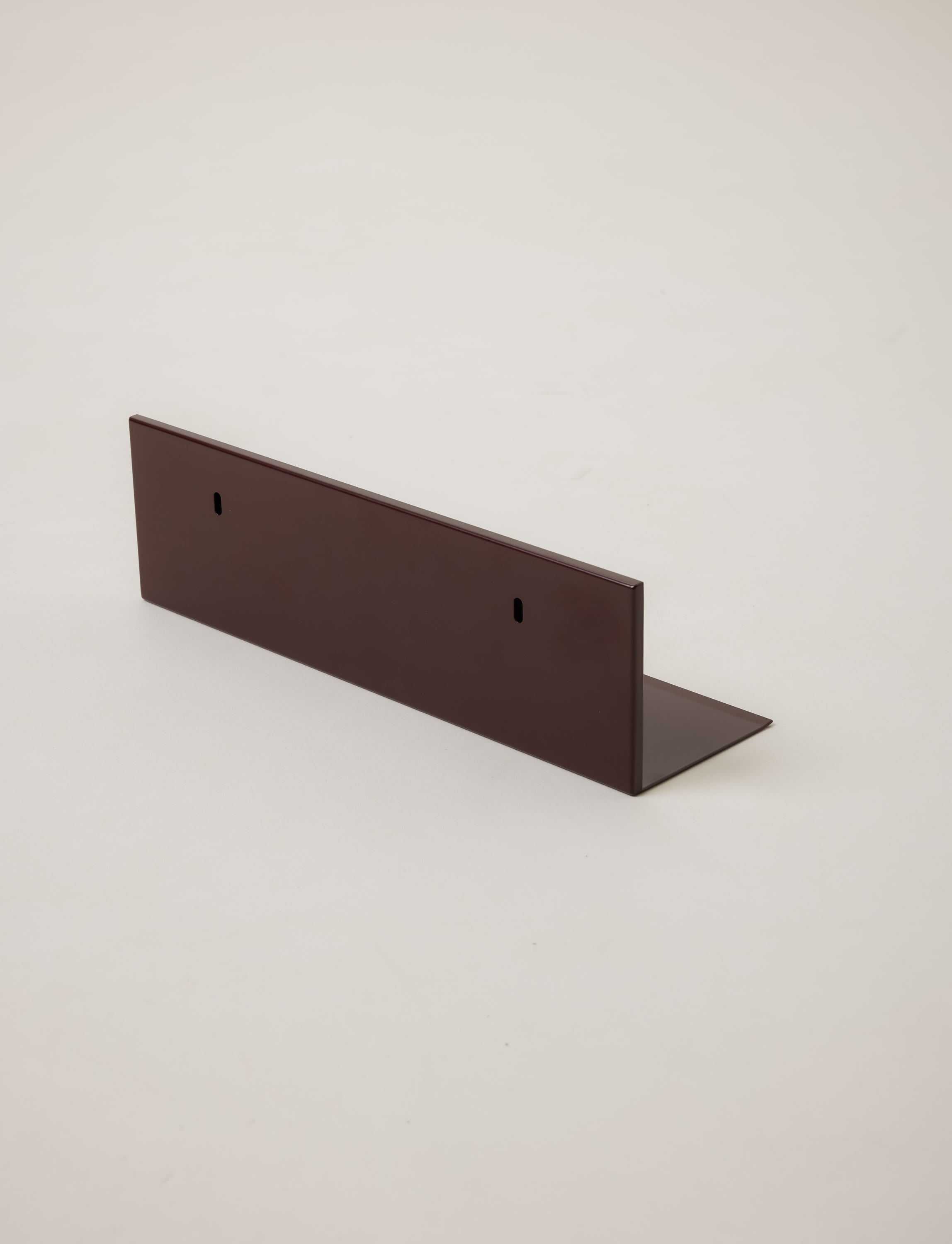 Mirror Steel Shelf — angled view of dark steel finish