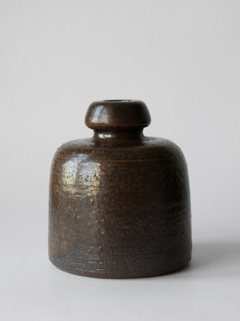 Dark brown glazed ceramic vase with rounded stopper by Rudi Stahl
