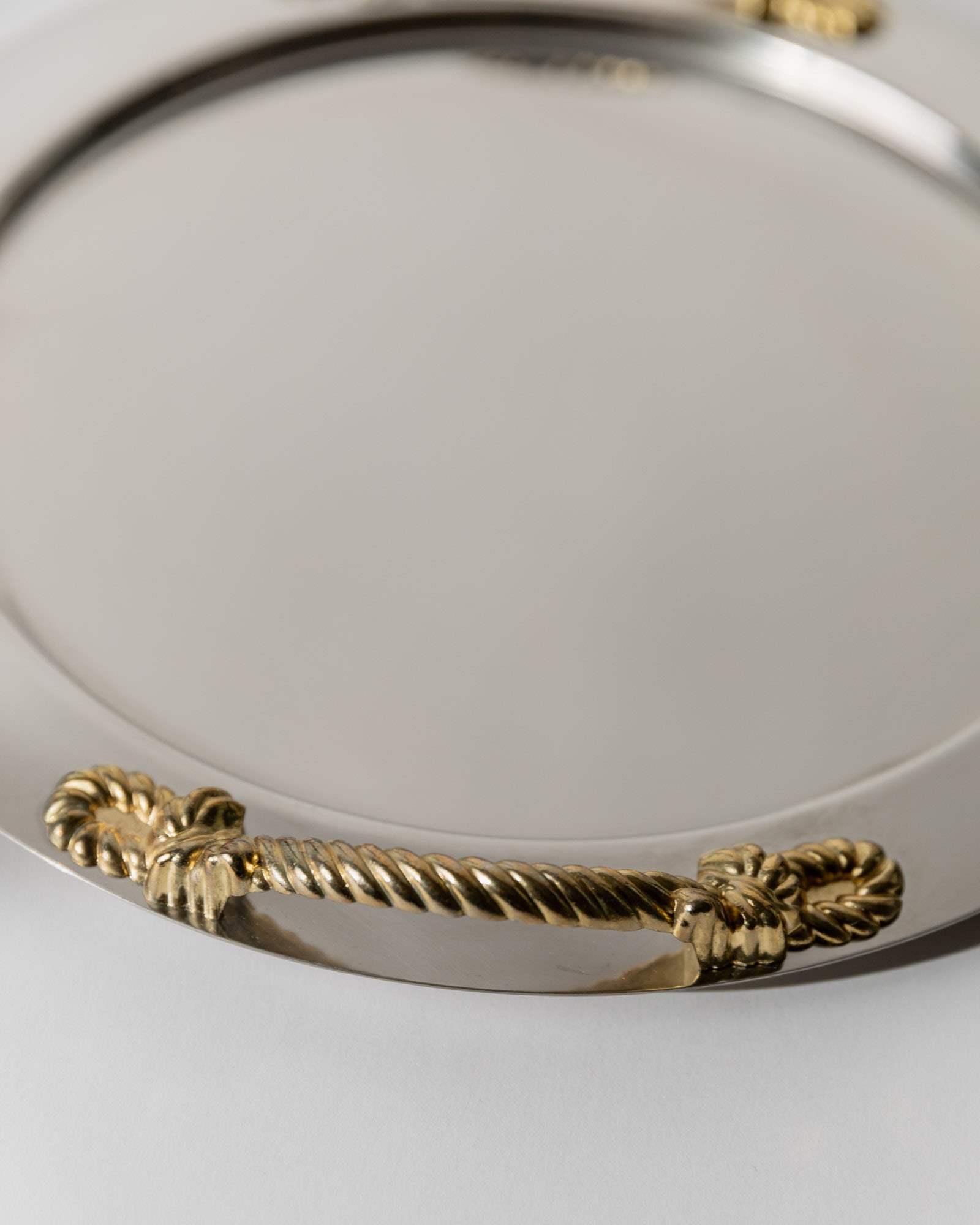 Vintage 1980s Stainless Steel Tray round, Gold Rope Handles by Inoxpran Italy — close-up of gold rope handles