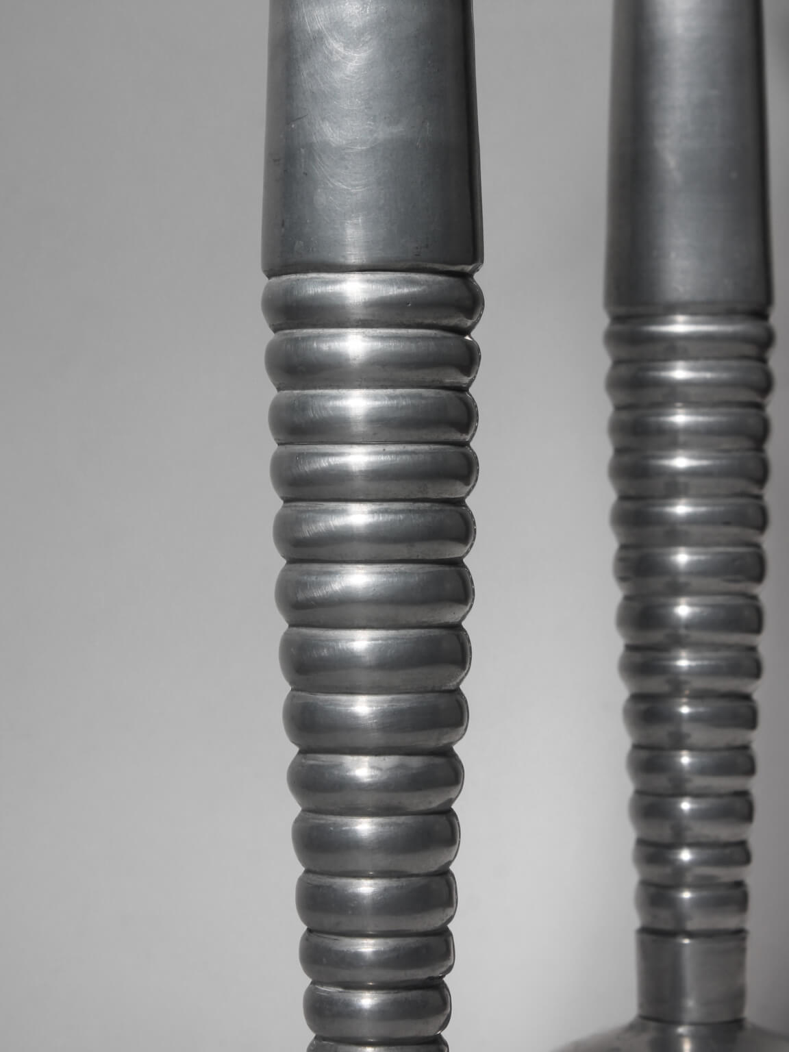 Pair Of Massive Rimmed Aluminum Candle Holders — close-up