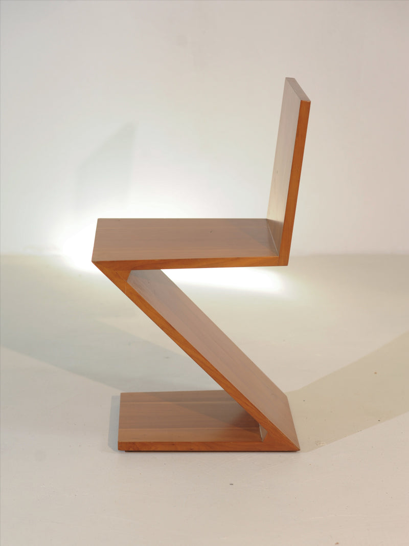 Modern beech wood Zig Zag chair profile view by Gerrit Rietveld
