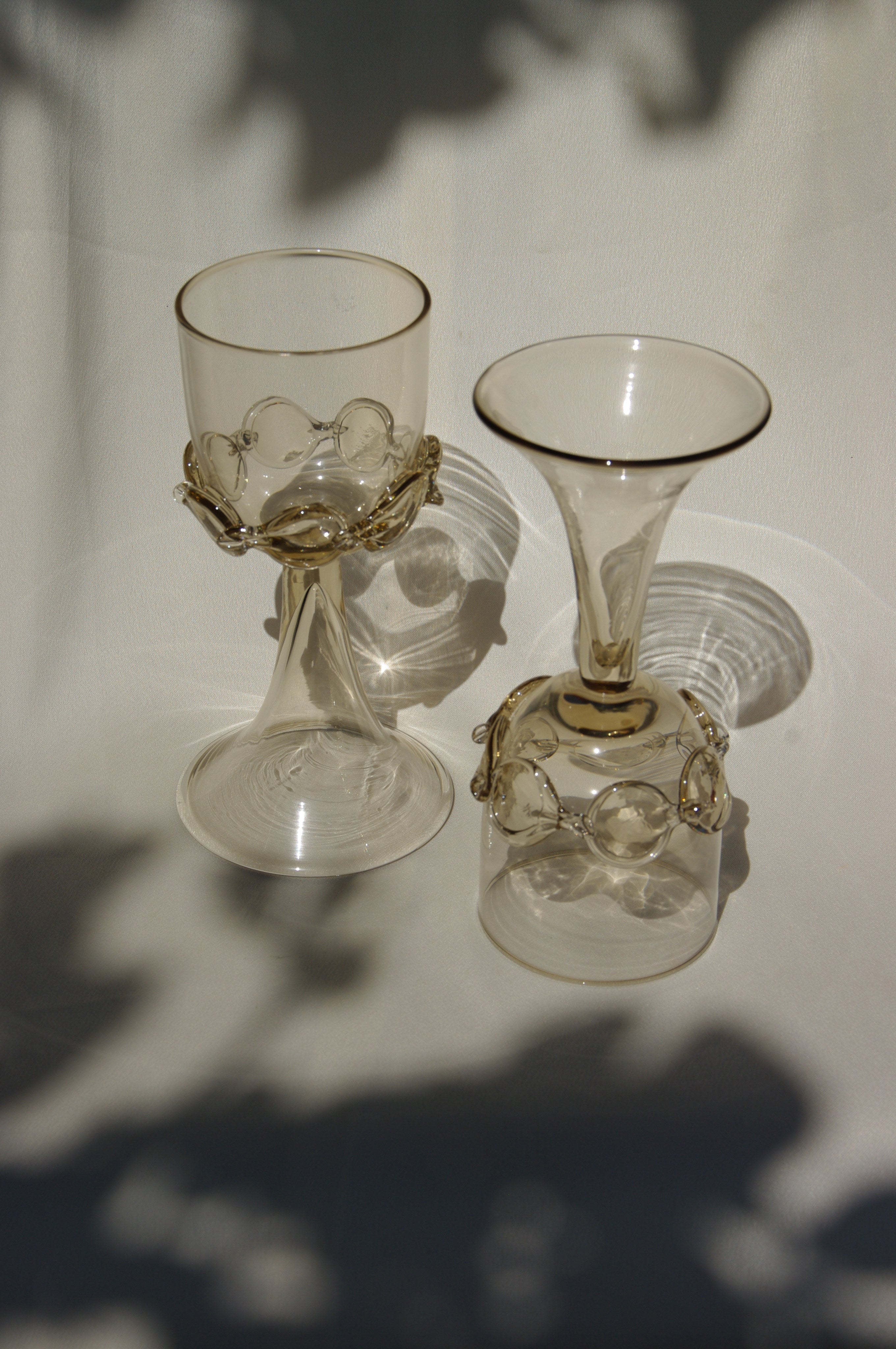 Pair of Mouthblown Wine Goblets - Chain — back view highlighting glass and brass details