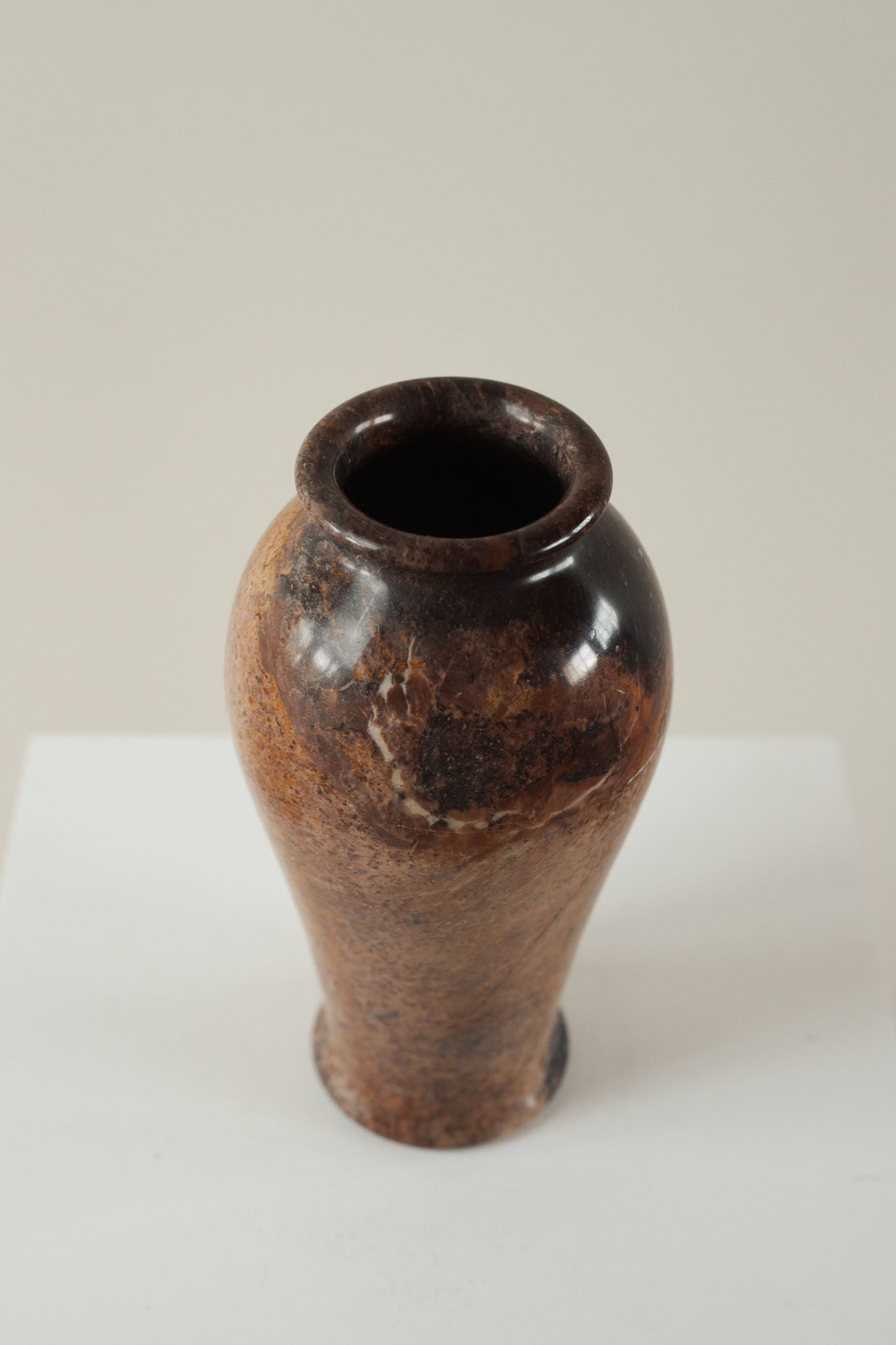 Brown marble vase with natural veining and polished finish