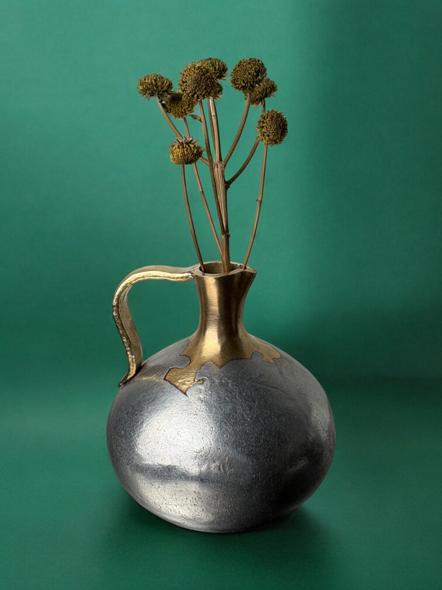 Brutalist Pitcher by David Marshall, 1970s — side angle with metallic finish and dried flowers