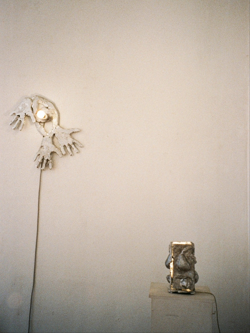 Out Of Shape ceramic wall lamp with hands motif by Ia Kutateladze