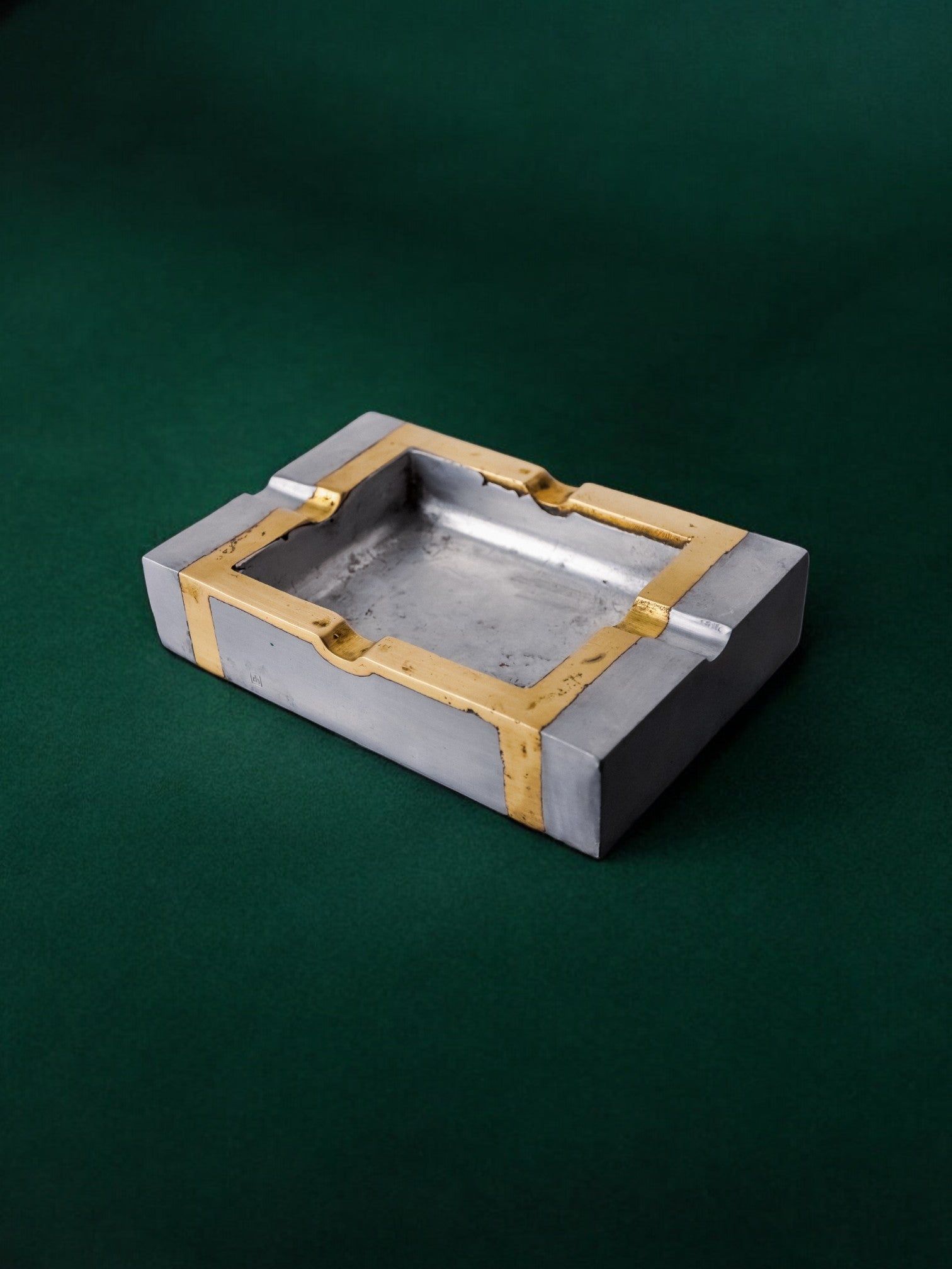 Brutalist Ashtray by David Marshall, 1970s — side angle on green backdrop
