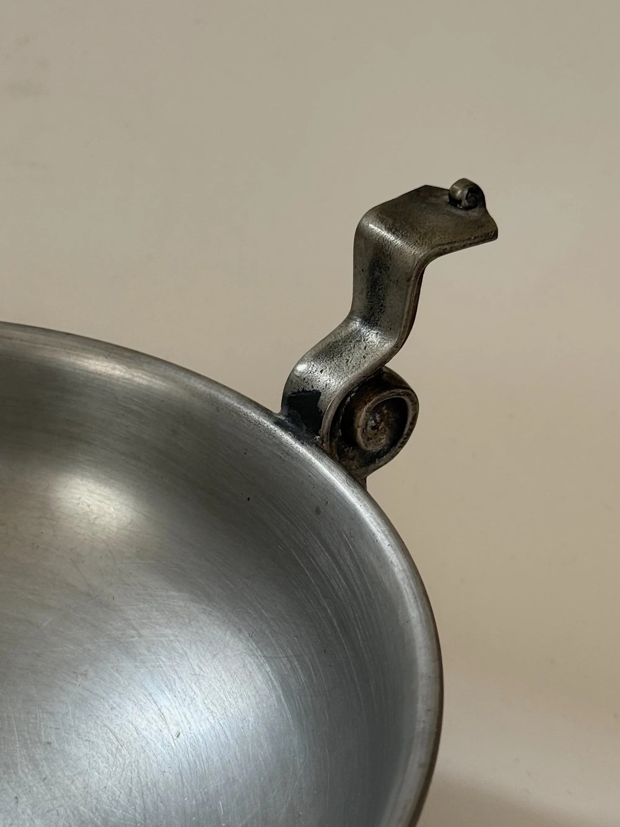Pewter Bowl with Scroll Handles Edvin Ollers, 1952 — close-up of scroll handle detail