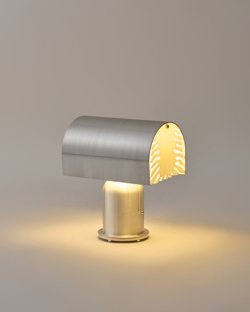 Bloom brushed steel table lamp with perforated shade by Hun Lee