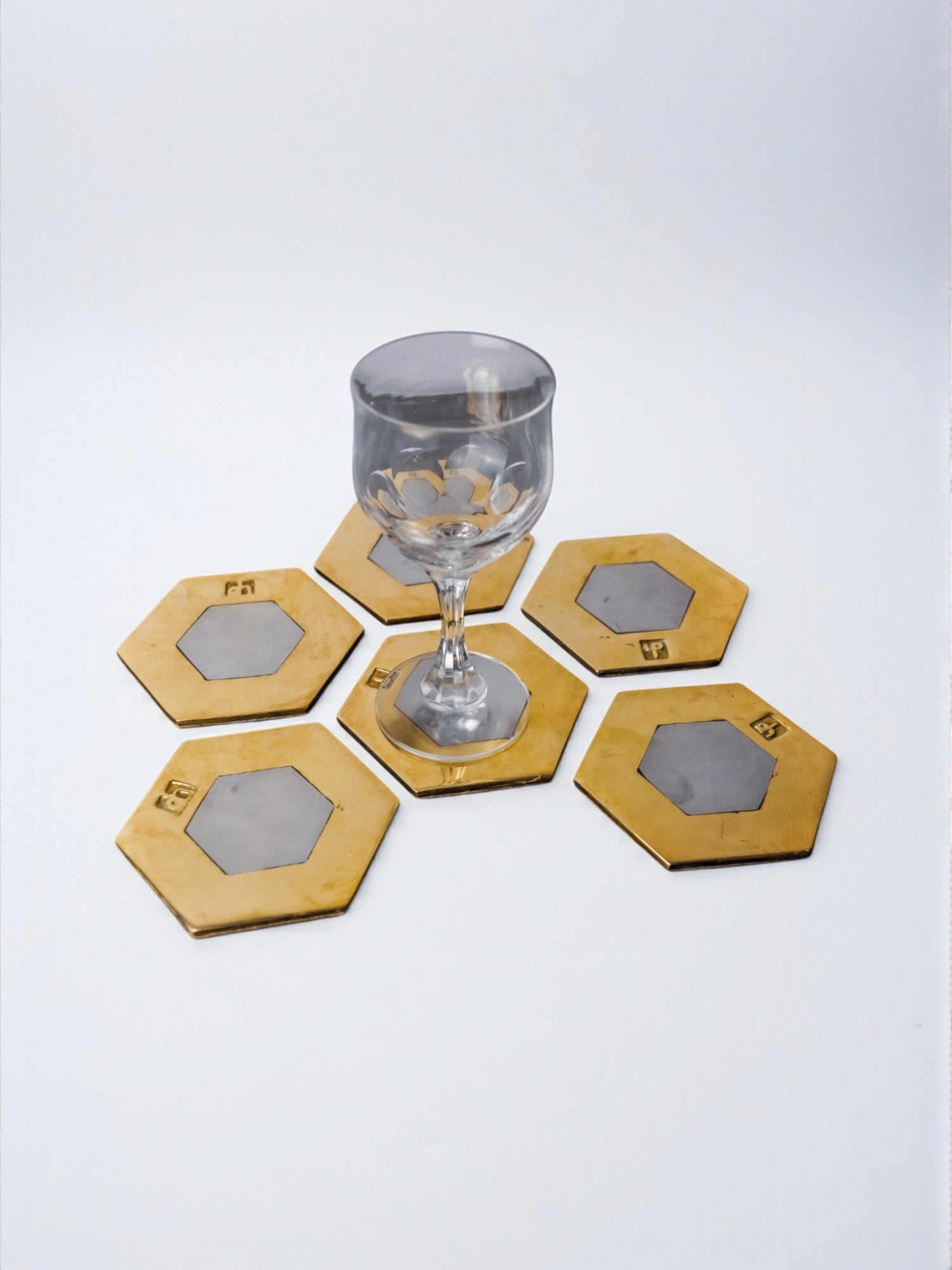 Set of 6 Brutalist Coasters by David Marshall, Spain, 1970s — side angle with glass on textured brass